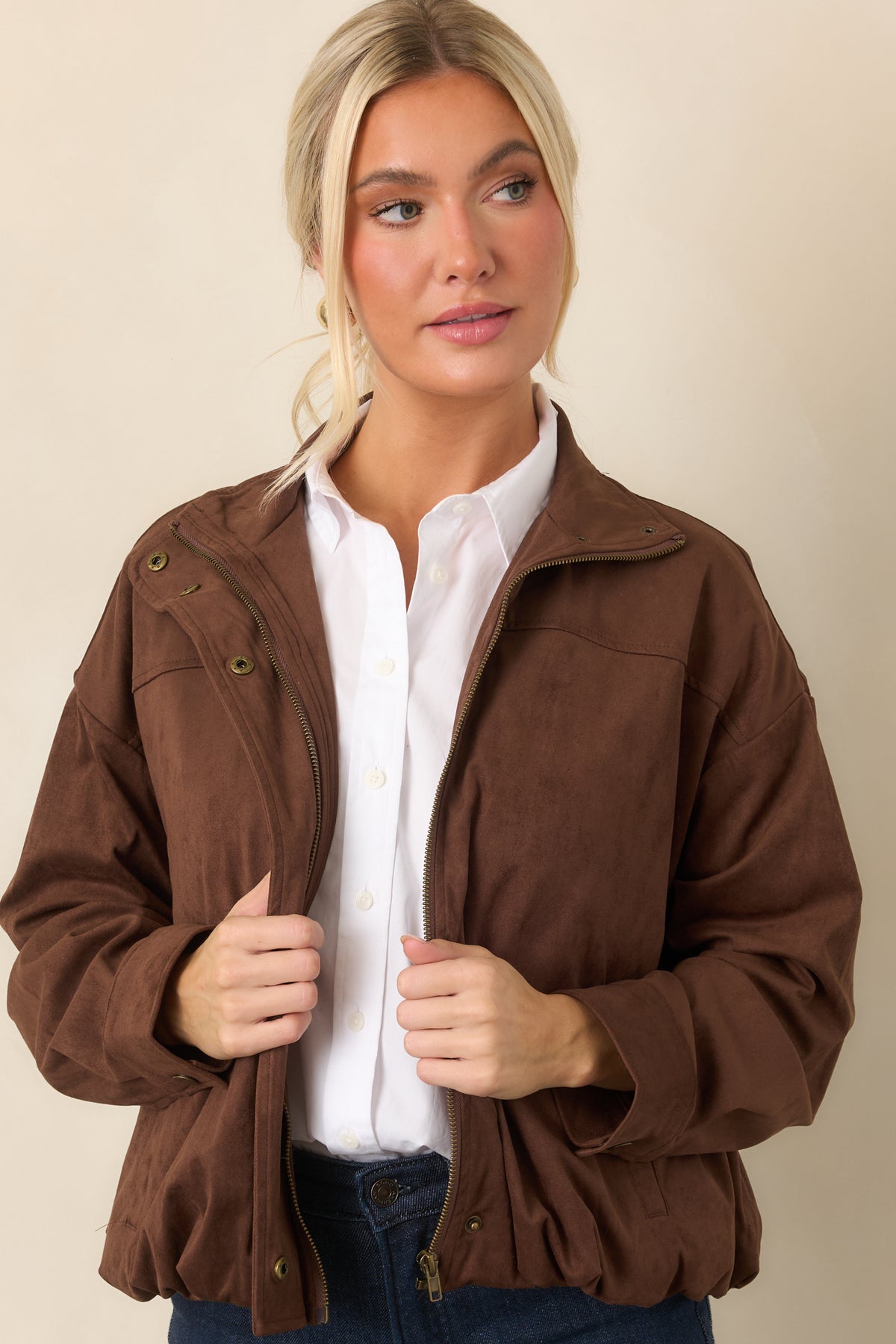 Chocolate brown faux suede jacket showcasing the clean snap-front placket and relaxed sleeve construction.