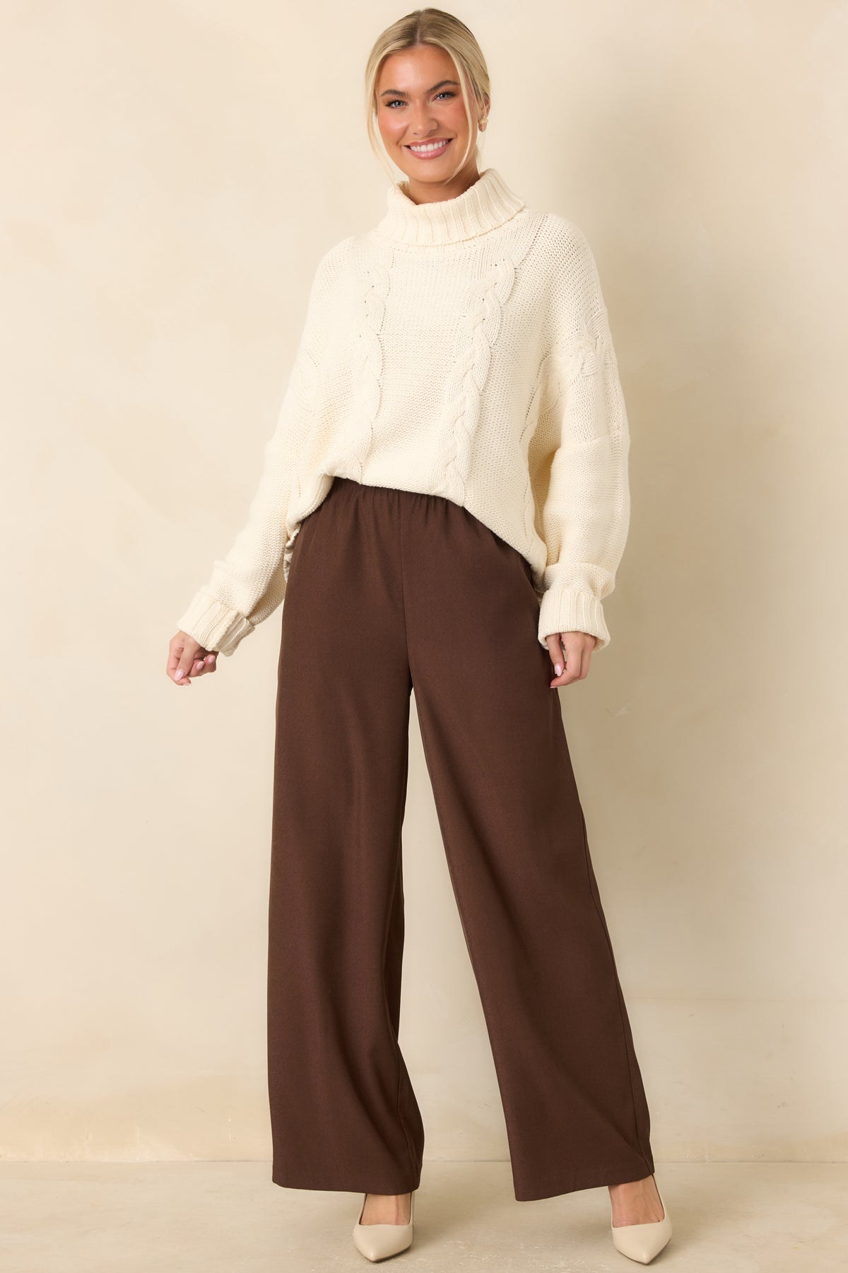 Fluid wide-leg pants in rich chocolate brown with clean hems and a relaxed silhouette.