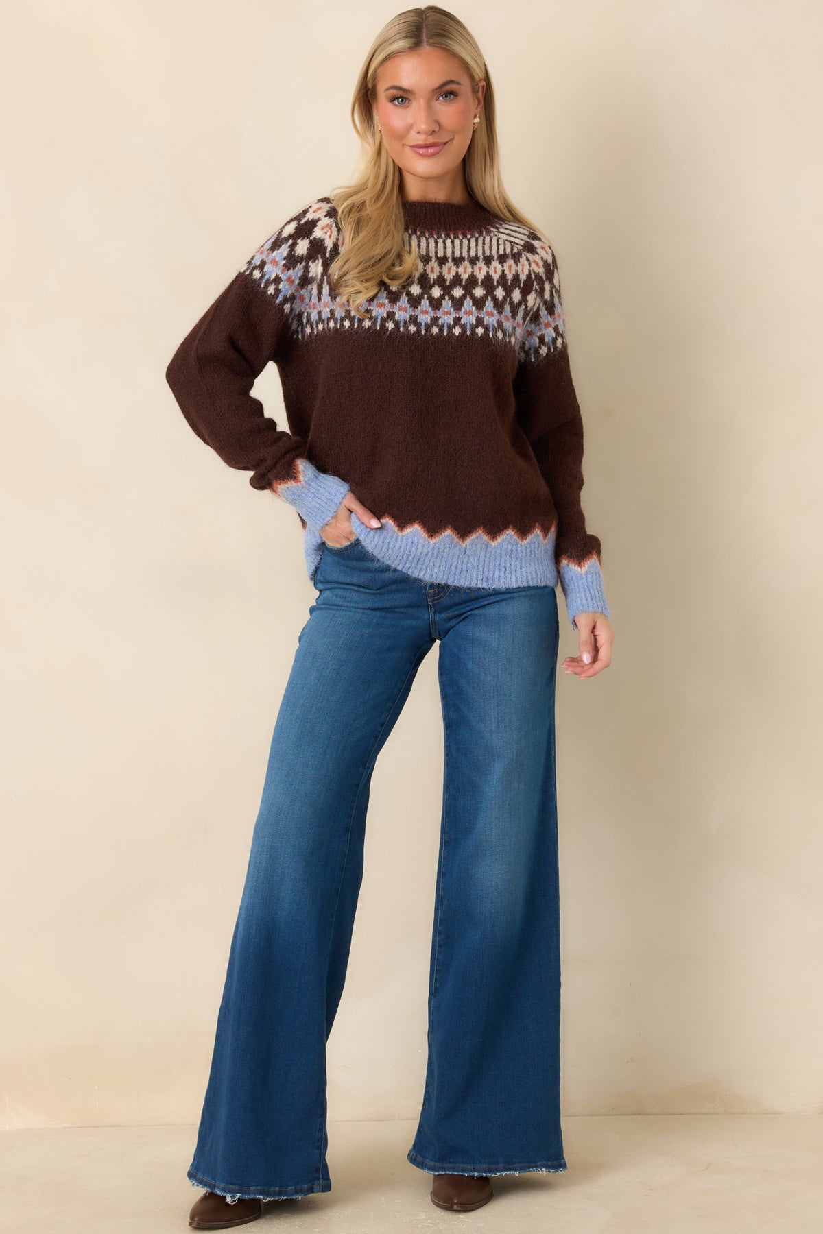 Chocolate brown fuzzy sweater with periwinkle cuffs and hem accented by ivory and rust.