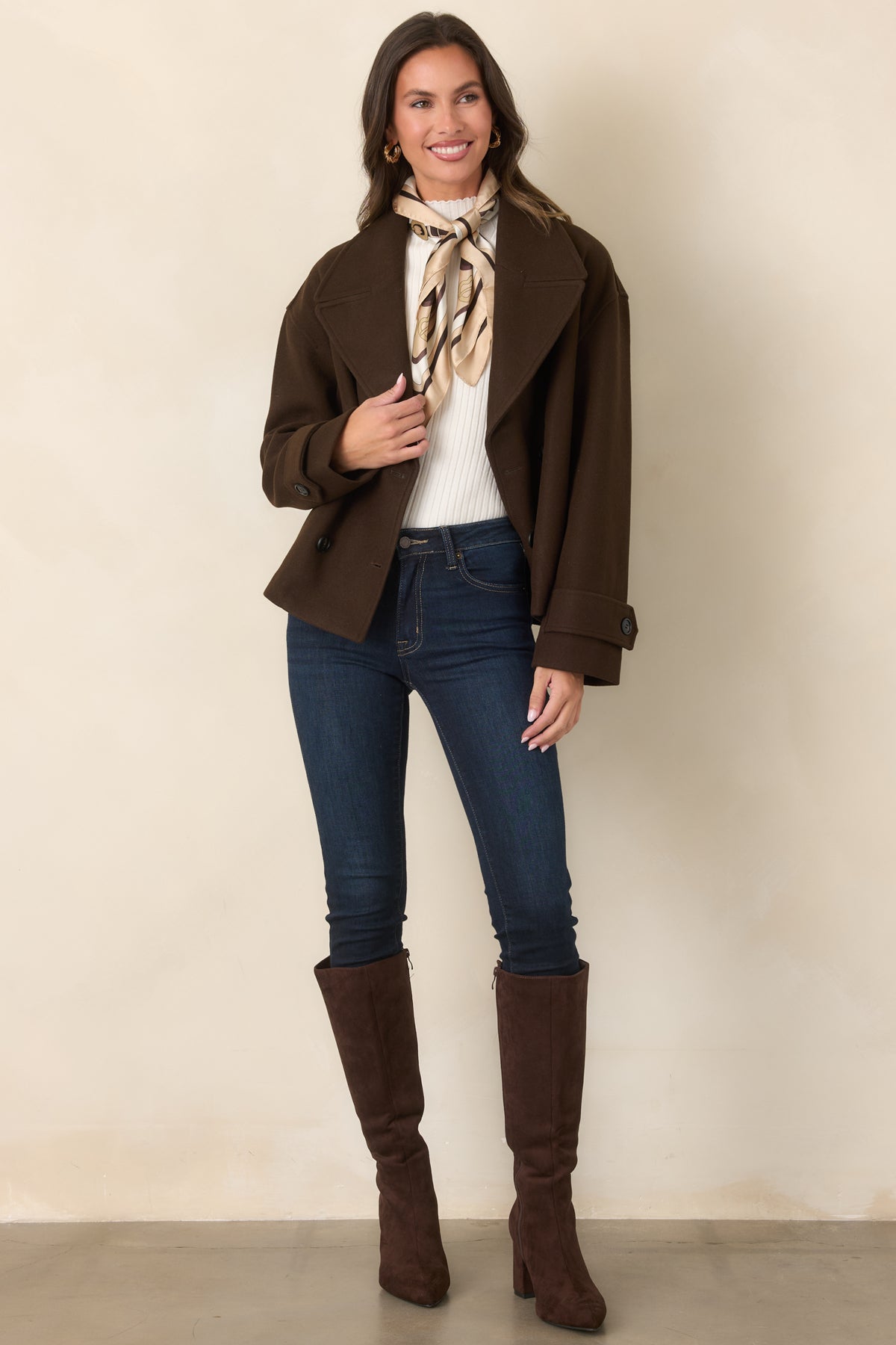 Rich chocolate brown jacket featuring oversized notched lapels and a classic double-breasted button front.