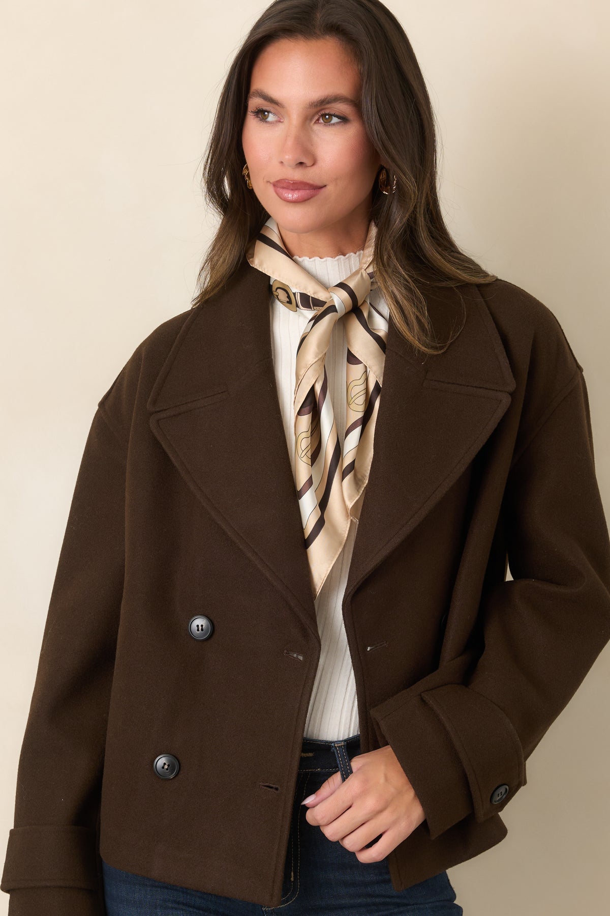 Chocolate brown jacket showcasing the relaxed boxy shape and cropped hem.