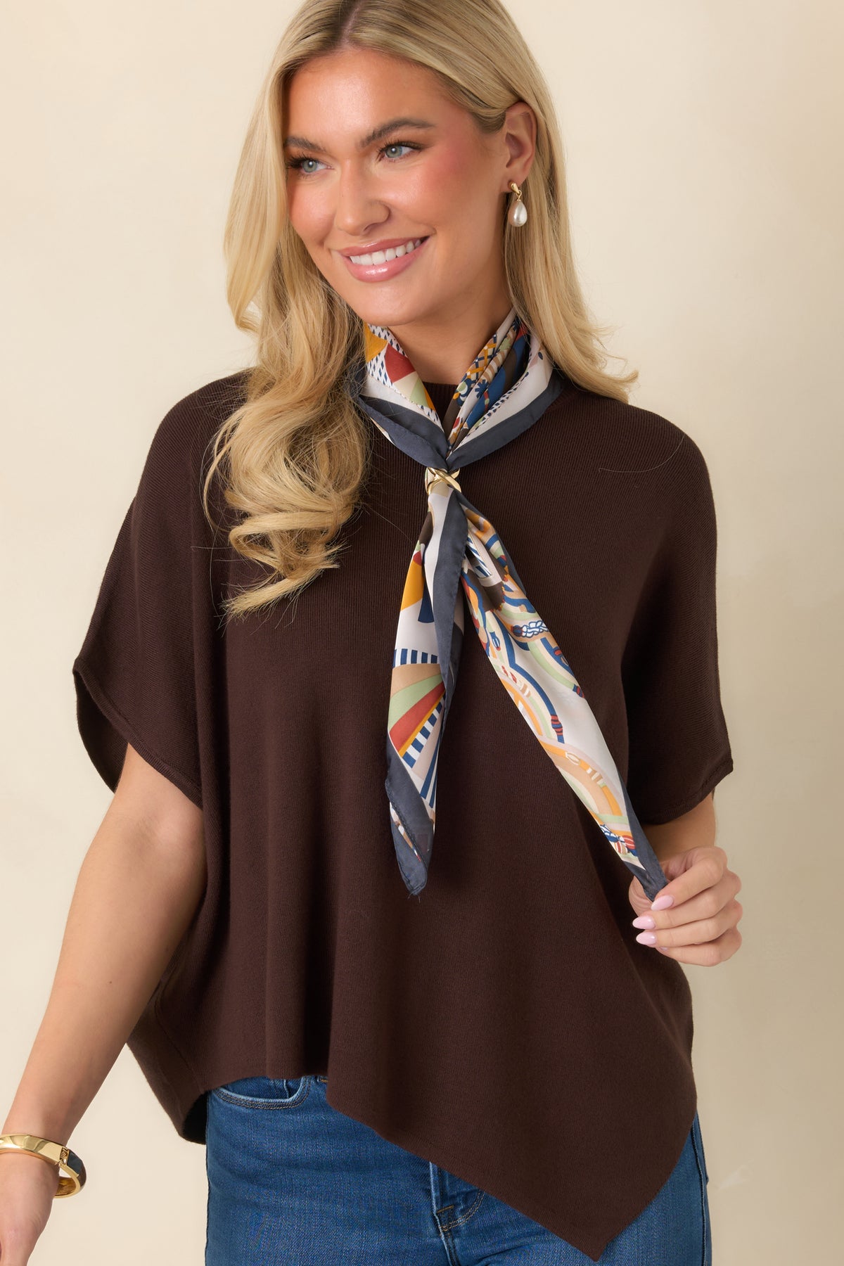 Chocolate brown top with a classic round neckline, short sleeves, and a softly draped shape.