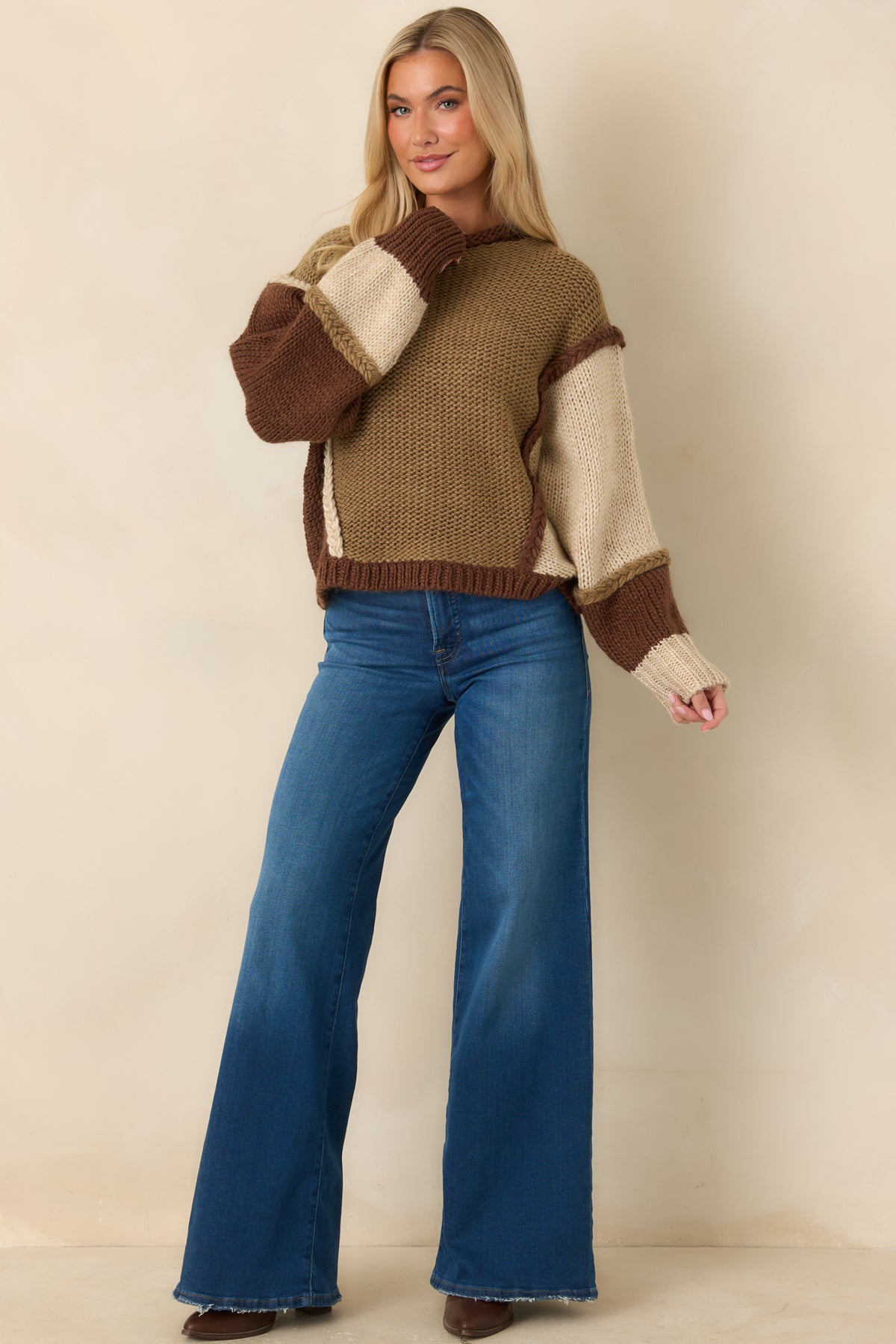 Chunky acrylic-and-wool blend pullover with contrasting body panels and a relaxed long-sleeve silhouette.