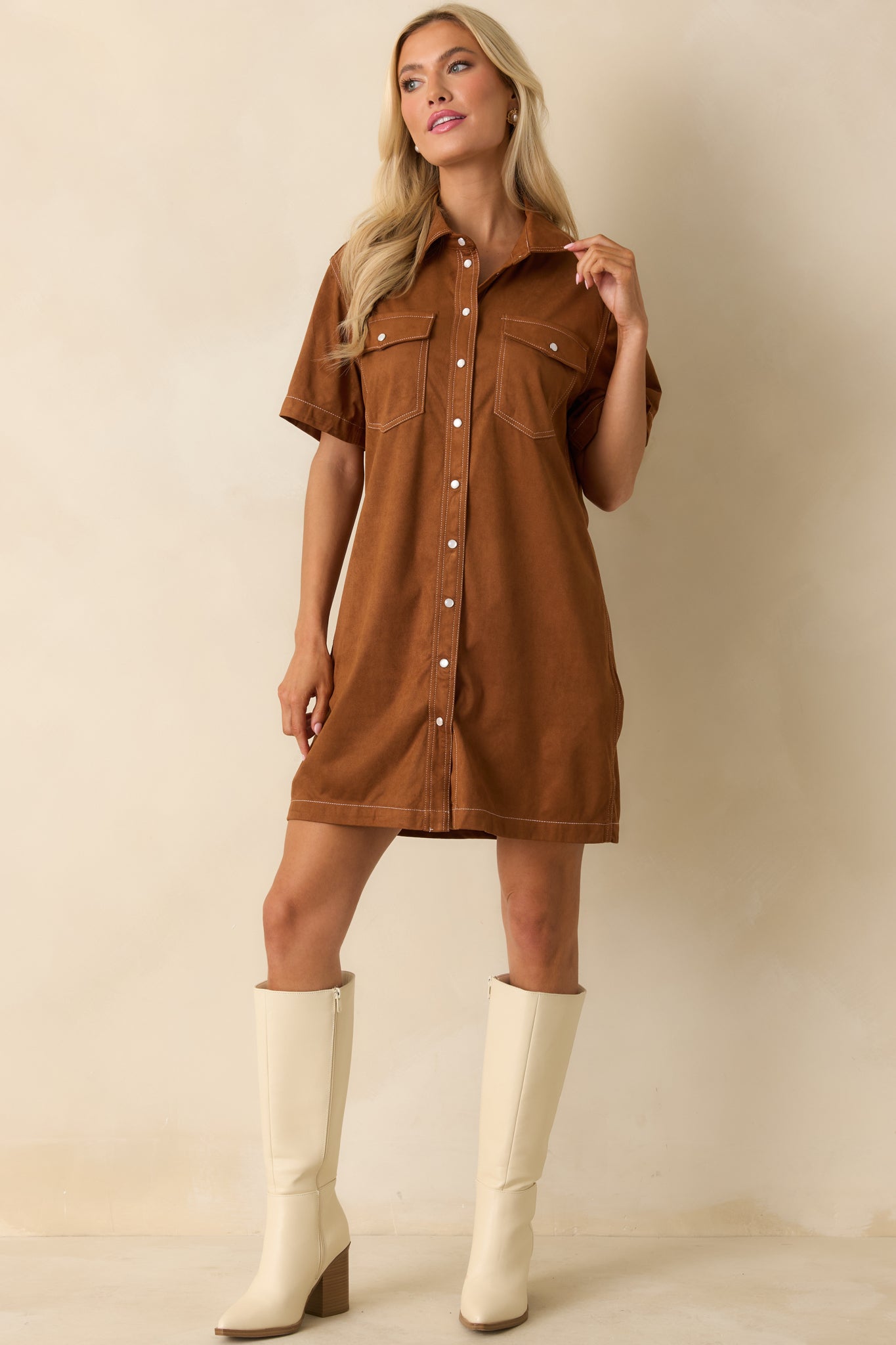 Cinnamon brown mini dress with collared neckline, short sleeves, and front flap pockets in soft faux suede.