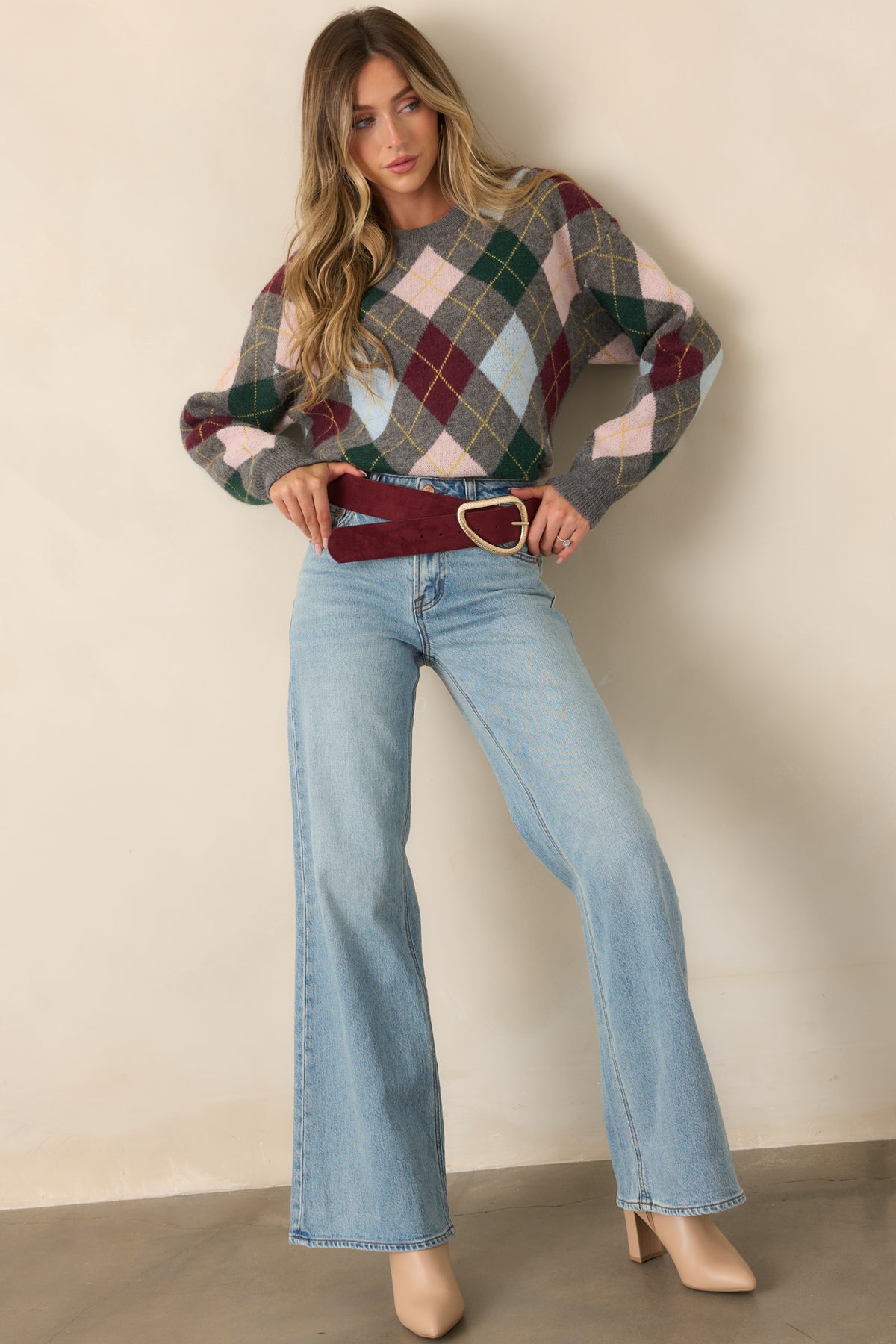 Classic argyle top featuring a crew neckline, long sleeves, and ribbed trim at the cuffs and hem.