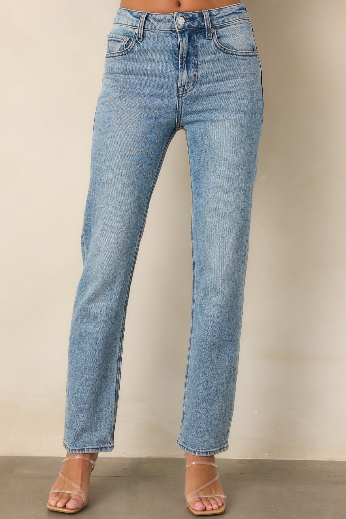 Classic denim jeans with subtle fading, belt loops, and a structured straight-leg fit.