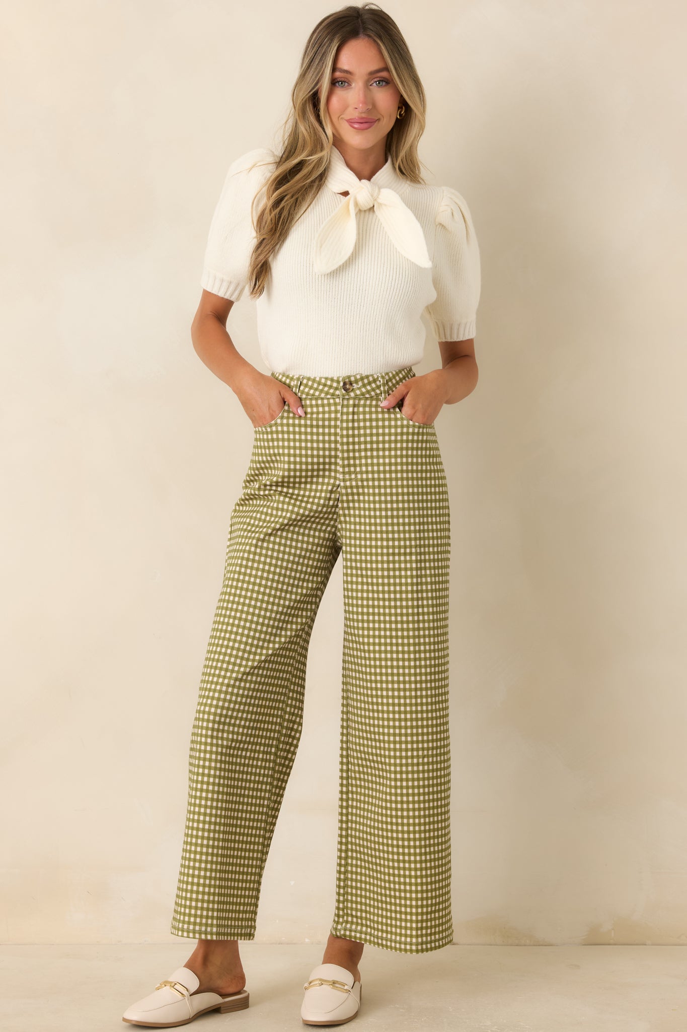 Classic ivory ribbed top with a feminine self-tie neckline, puff sleeves, and a flattering fitted design.