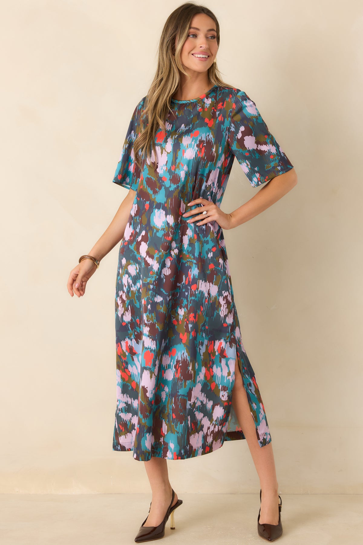 Classic midi dress with a rounded neckline, softly draped shape, and side slits at the hem.