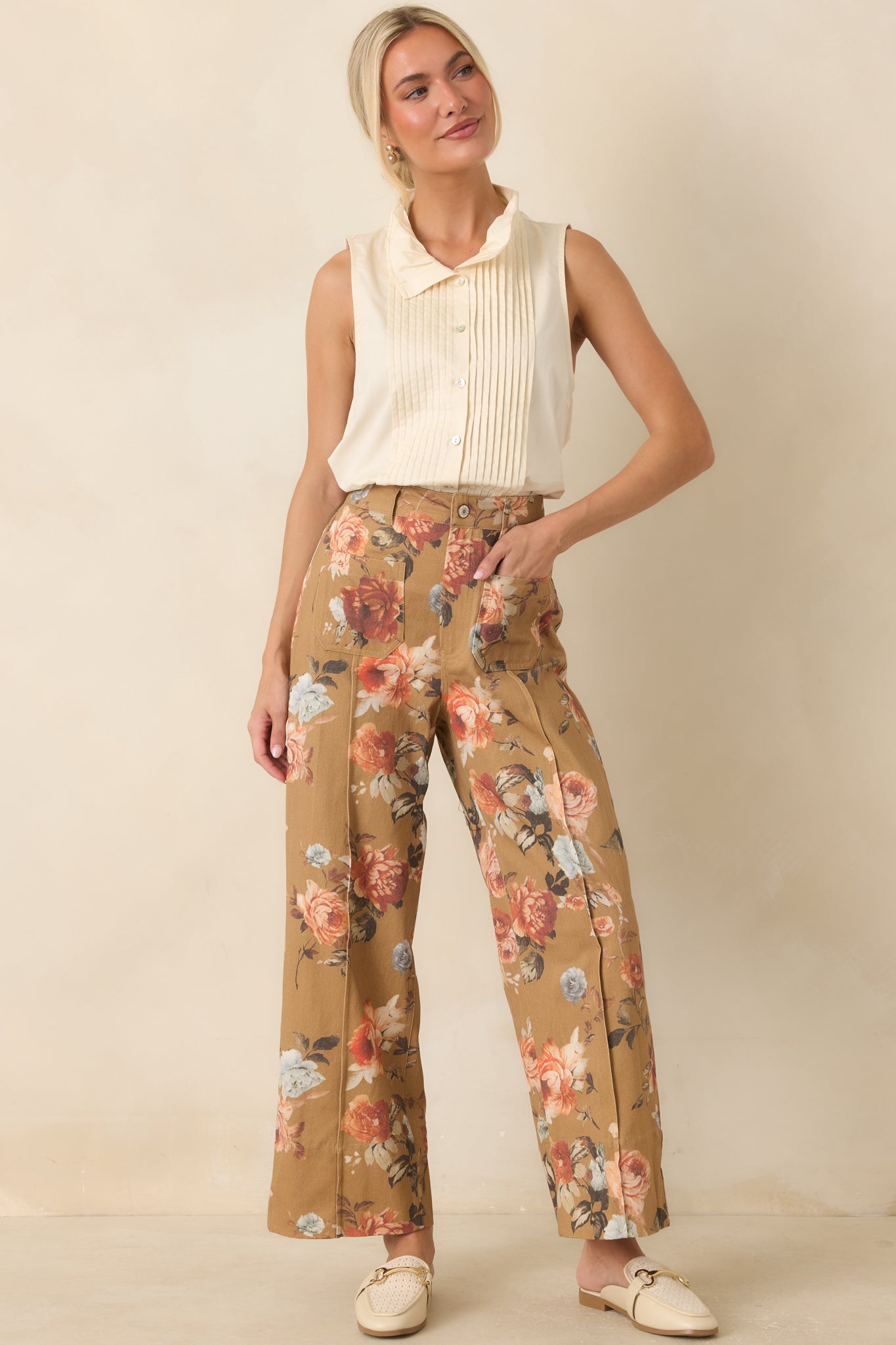 Classic white blouse featuring textured pintuck detailing throughout, a collared neckline, and a lightweight sleeveless silhouette.