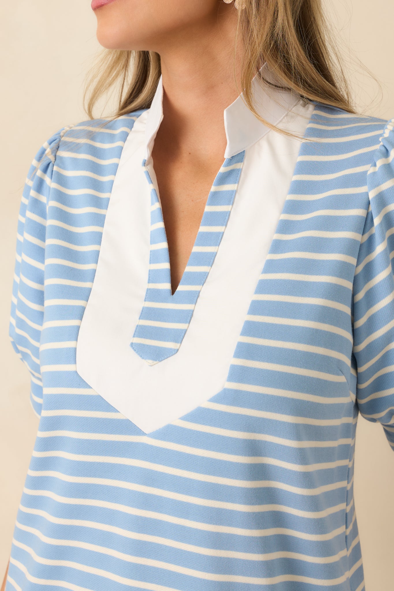 Tight detail of the neckline trim and soft knit fabric with sweatshirt-style appeal.