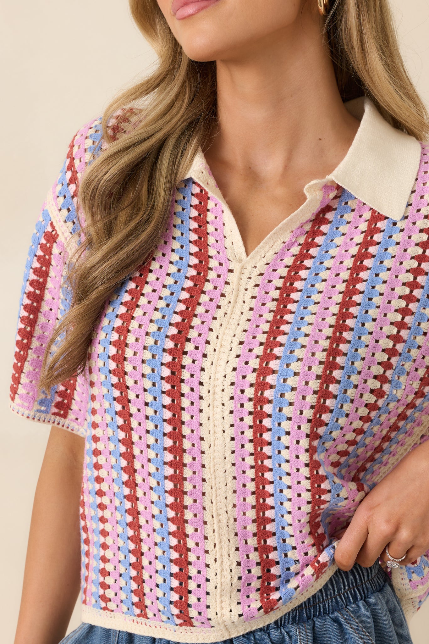 Close-up of contrast collar and multicolor woven stripe texture.