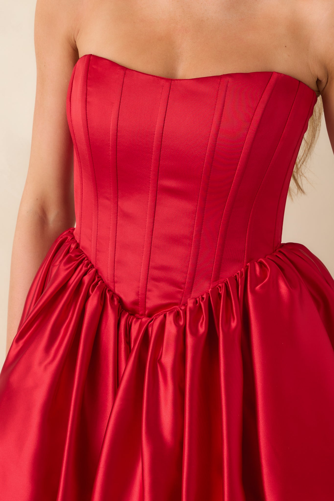 A detailed close-up of the corset boning, v-waistline, and fabric texture.