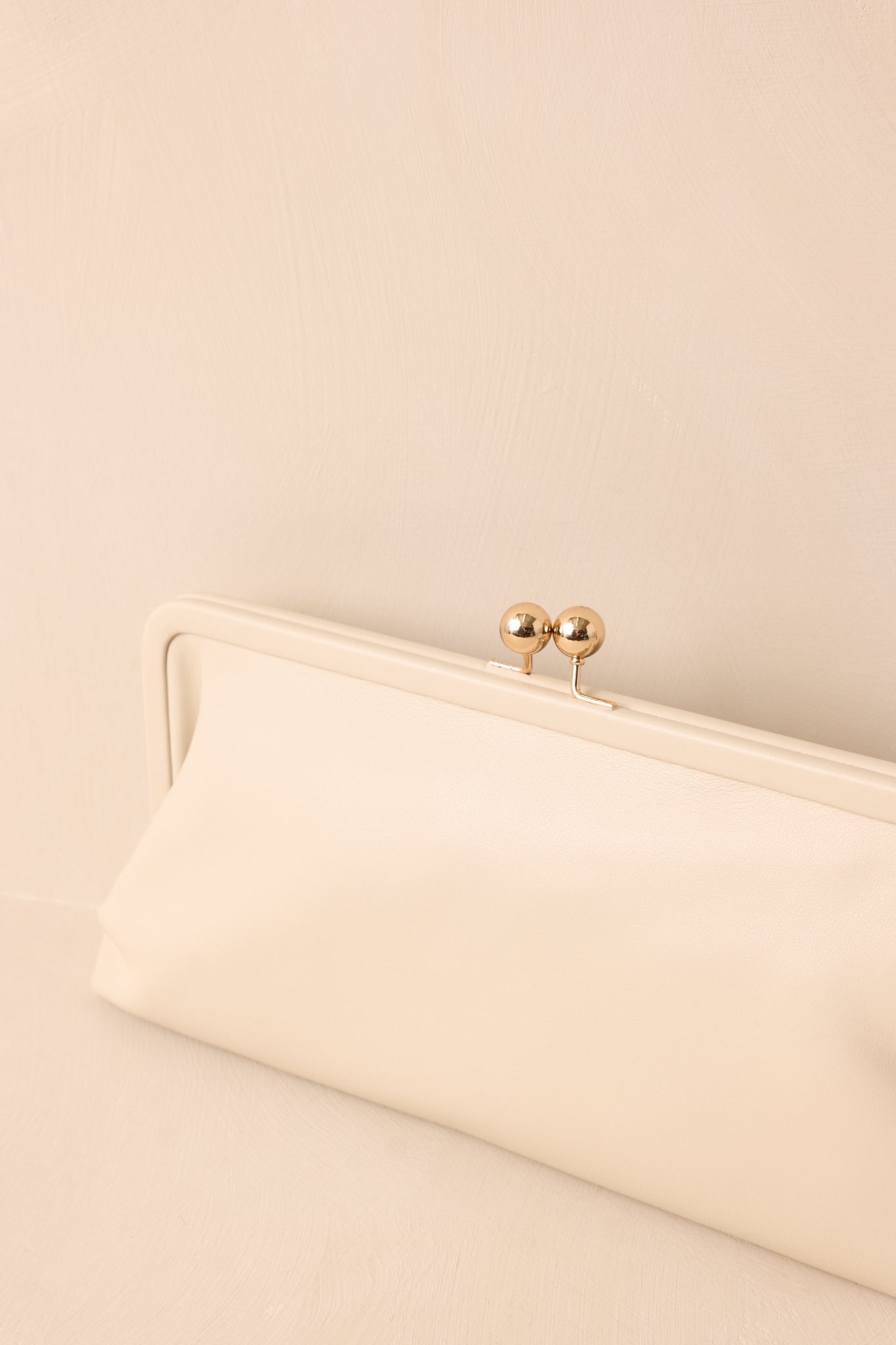 Close up shot showing the smooth faux leather texture and sleek silhouette.