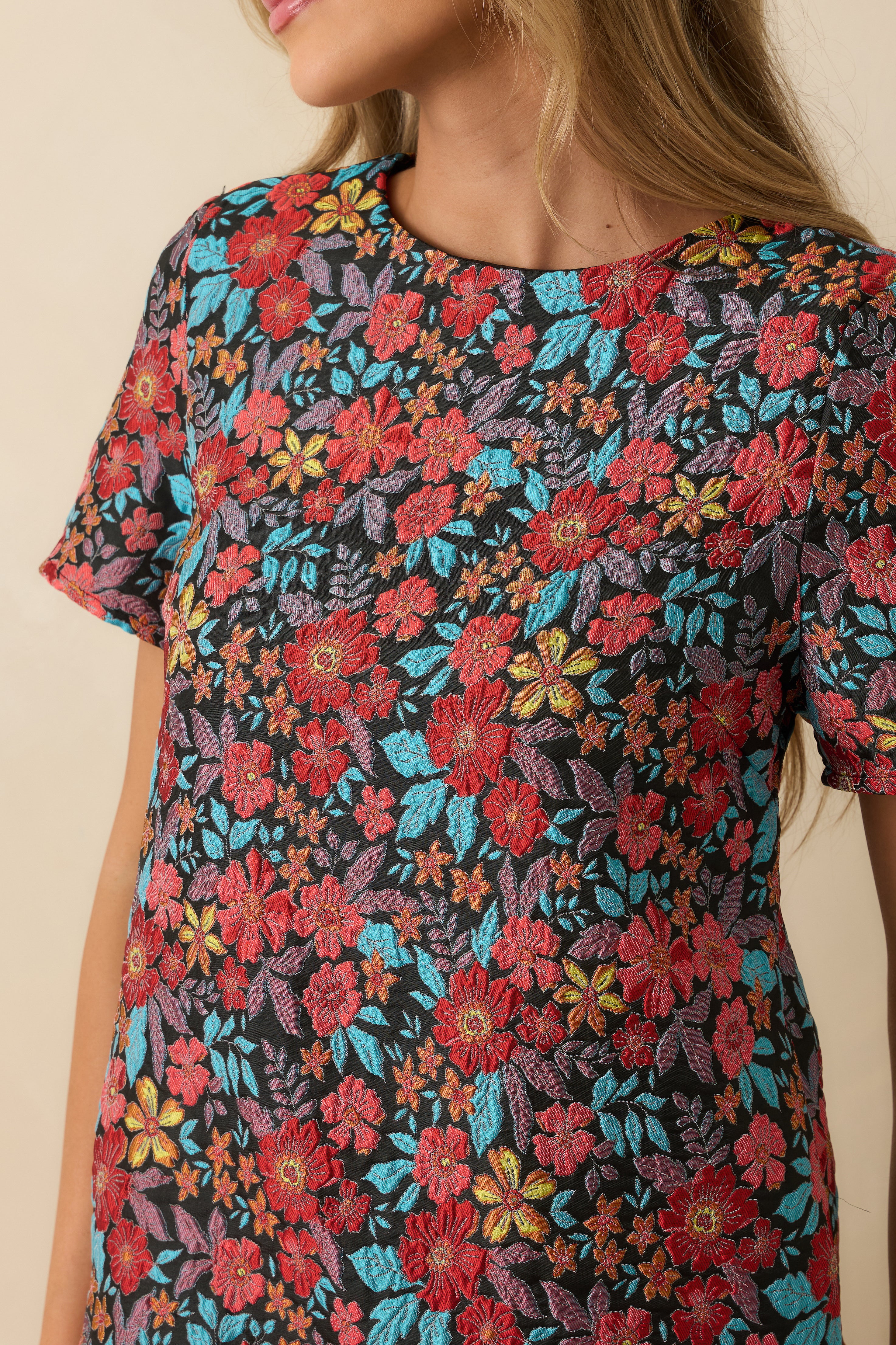 Close-up of the jacquard fabric capturing the raised floral pattern and woven texture.