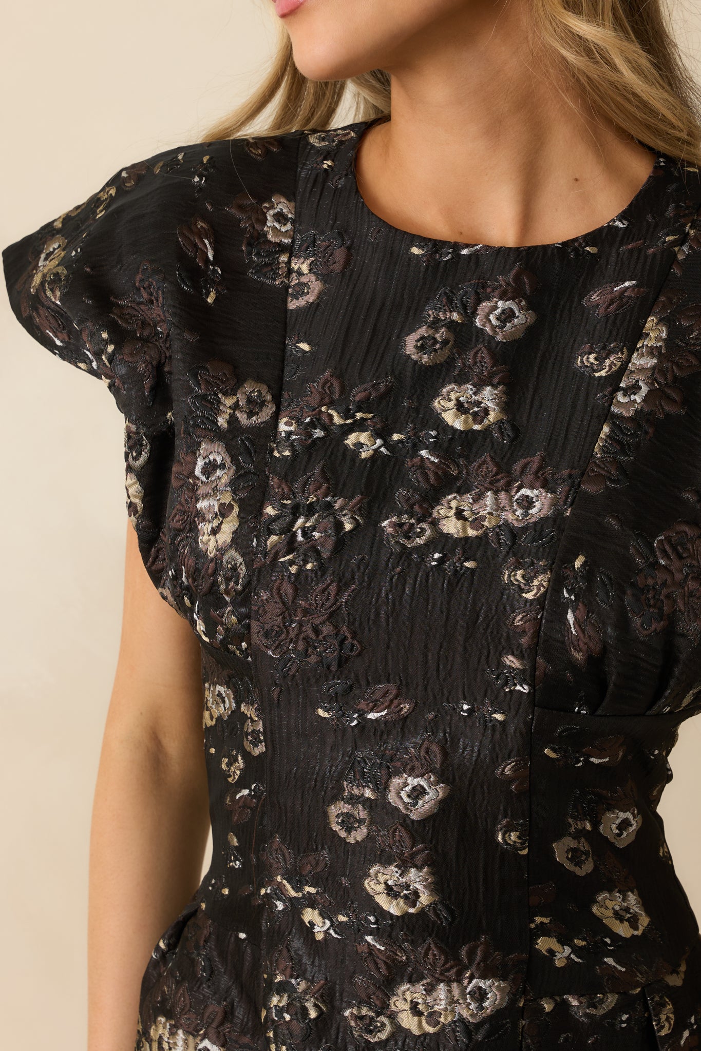 Close-up showing the metallic floral jacquard pattern and smooth fabric lining.