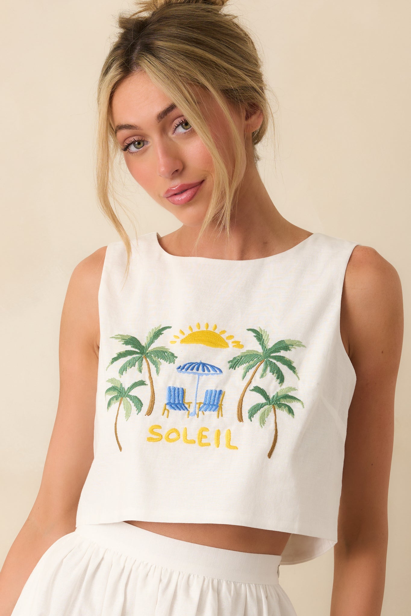 Close-up of cotton blend fabric with coastal embroidery and clean finish.