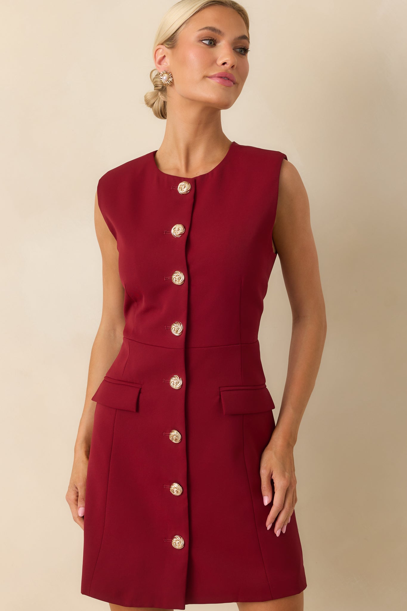 Close-up crop of the faux flap pocket on one side of the dress, showing stitching and texture.