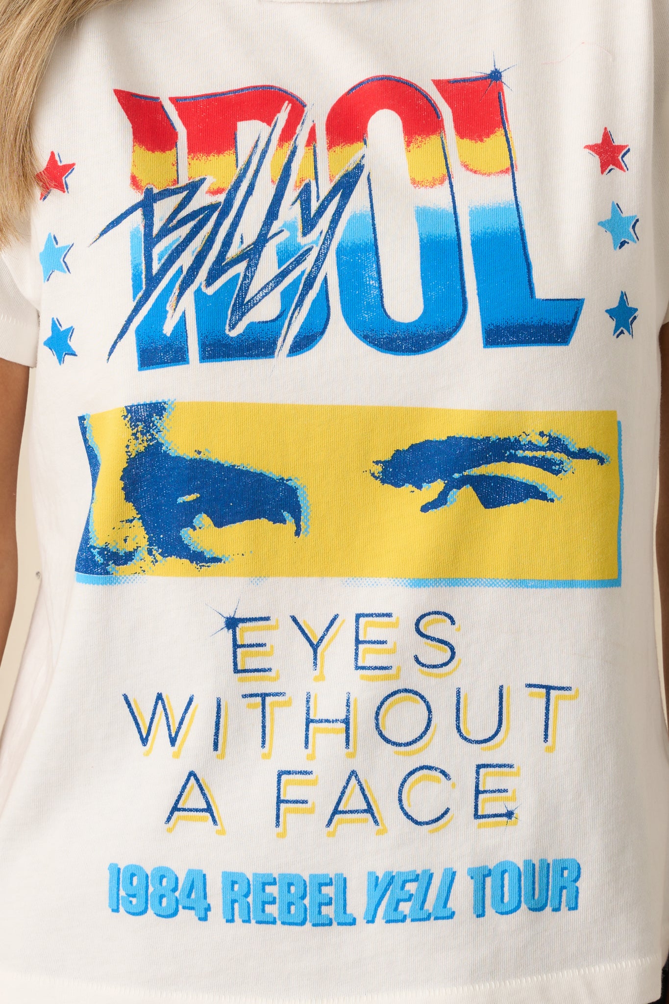 Extreme close-up of the reverse seam stitching on the neckline and shoulder, showing the inside-out construction style.