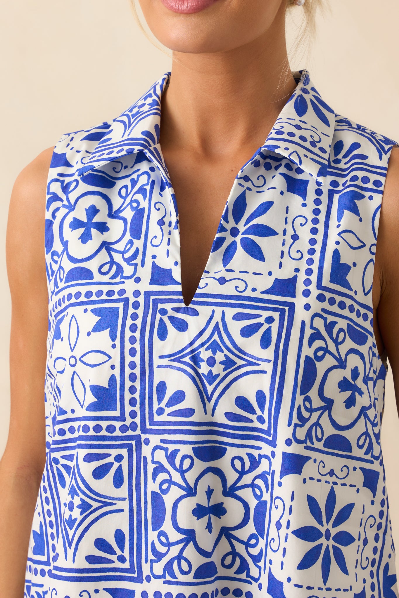 Close-up of the Sicilian tile print fabric, showing the intricate blue and white design and soft texture.