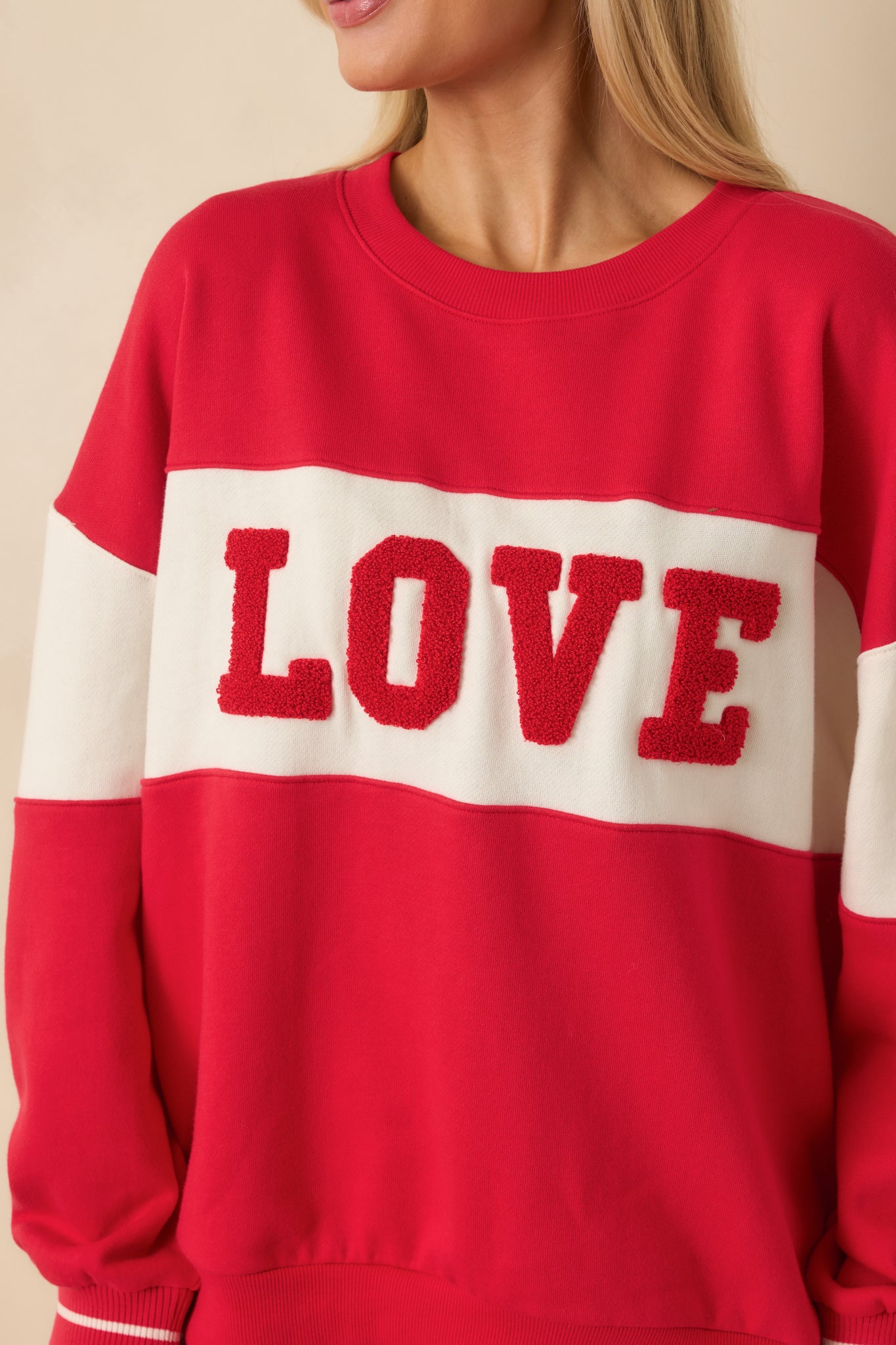 Close-up of the textured “LOVE” lettering and soft fleece surface
