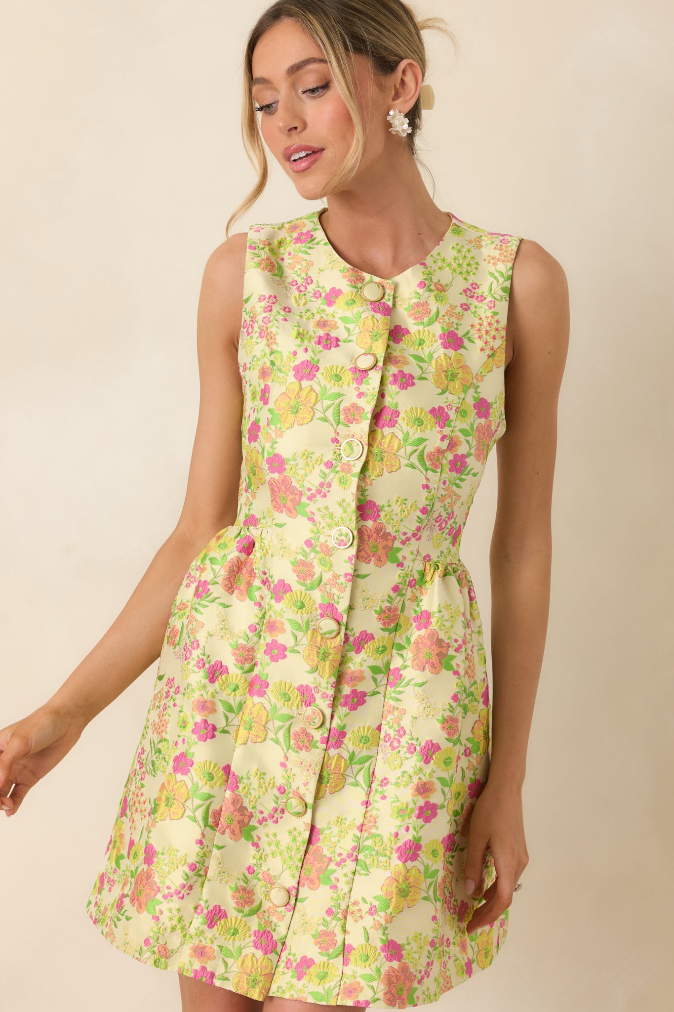 Close-up of upper bodice highlighting round neckline and sleeveless design in vibrant floral print.
