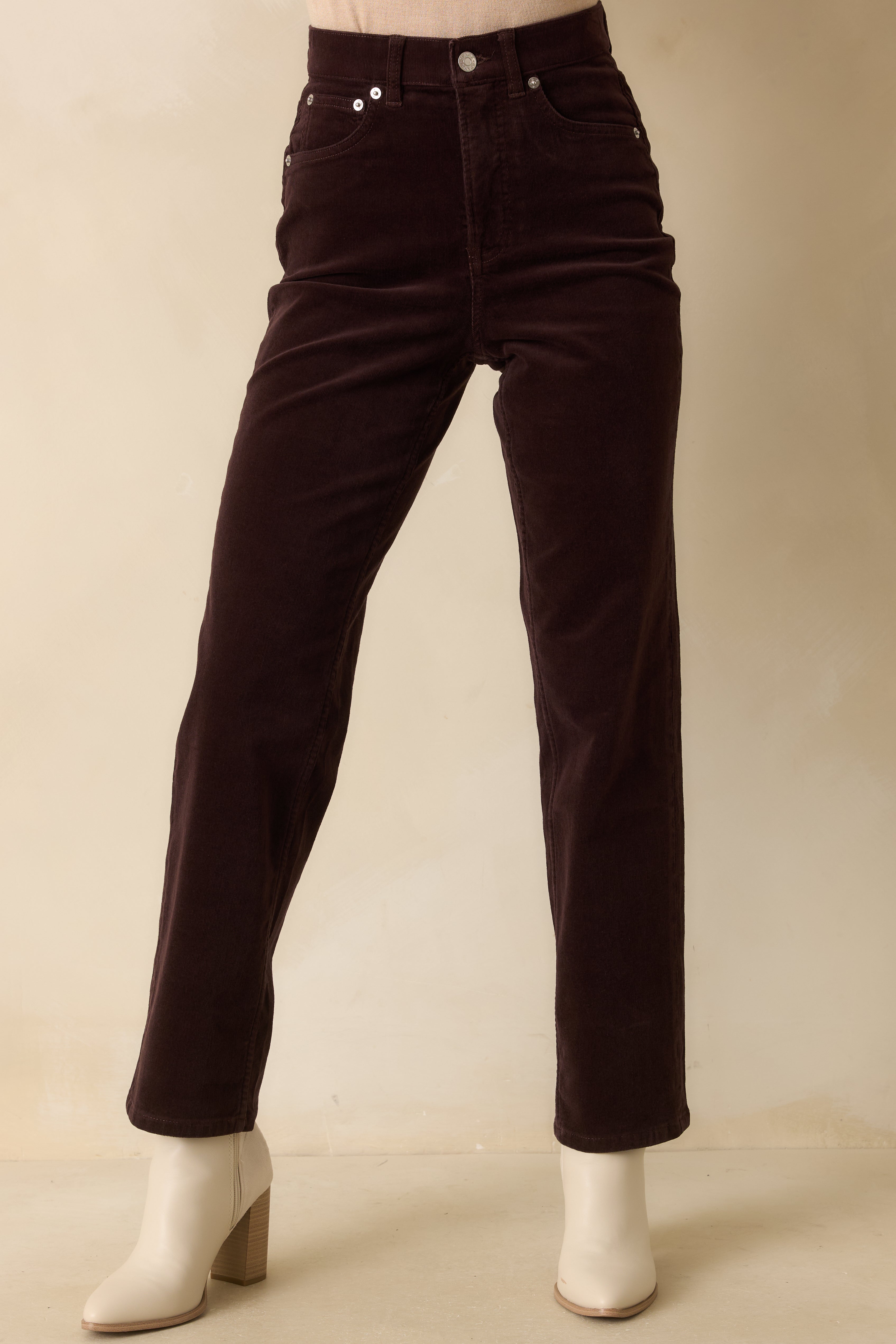 Close-up of the waist and upper thigh area highlighting the high-rise fit and smooth corduroy texture.