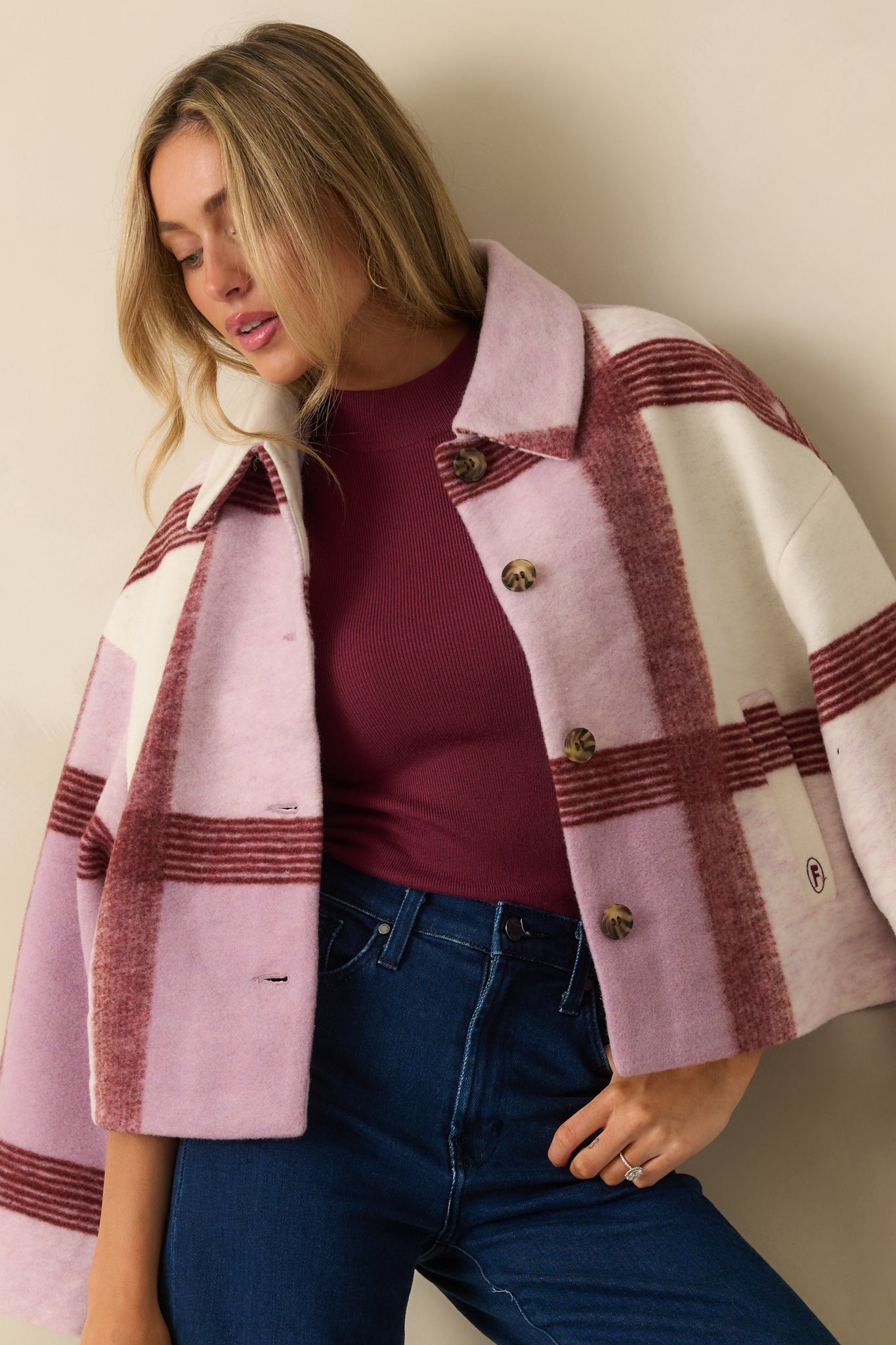 Close view of the jacket’s collar and upper chest, highlighting the soft brushed texture and plaid pattern.