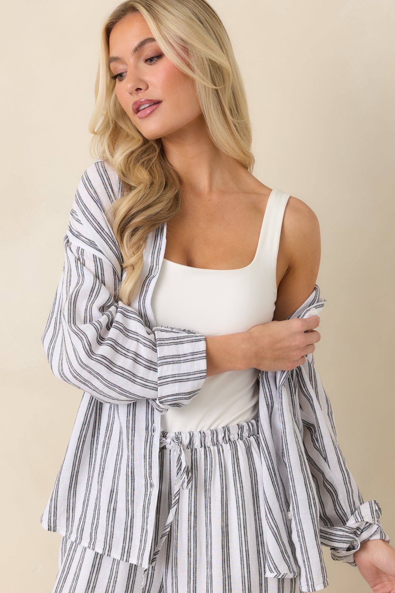 Close view of chest pocket with striped fabric and clean button placket.