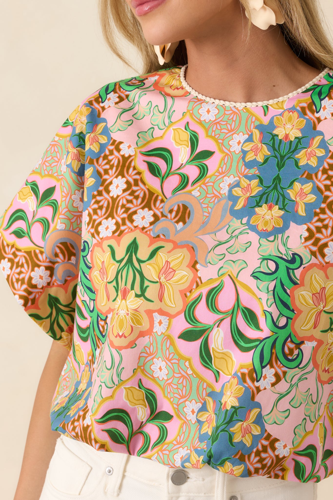 Close view of elastic balloon hem and colorful vintage-inspired print on breathable cotton fabric.