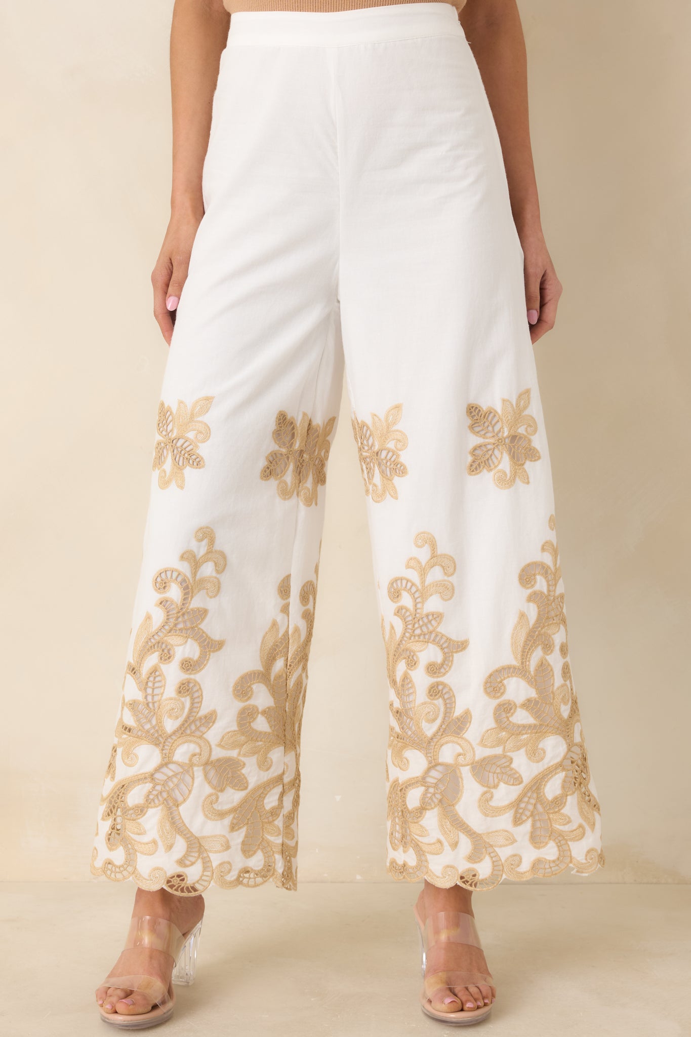 Close view of ivory waistband and flattering high-rise fit.