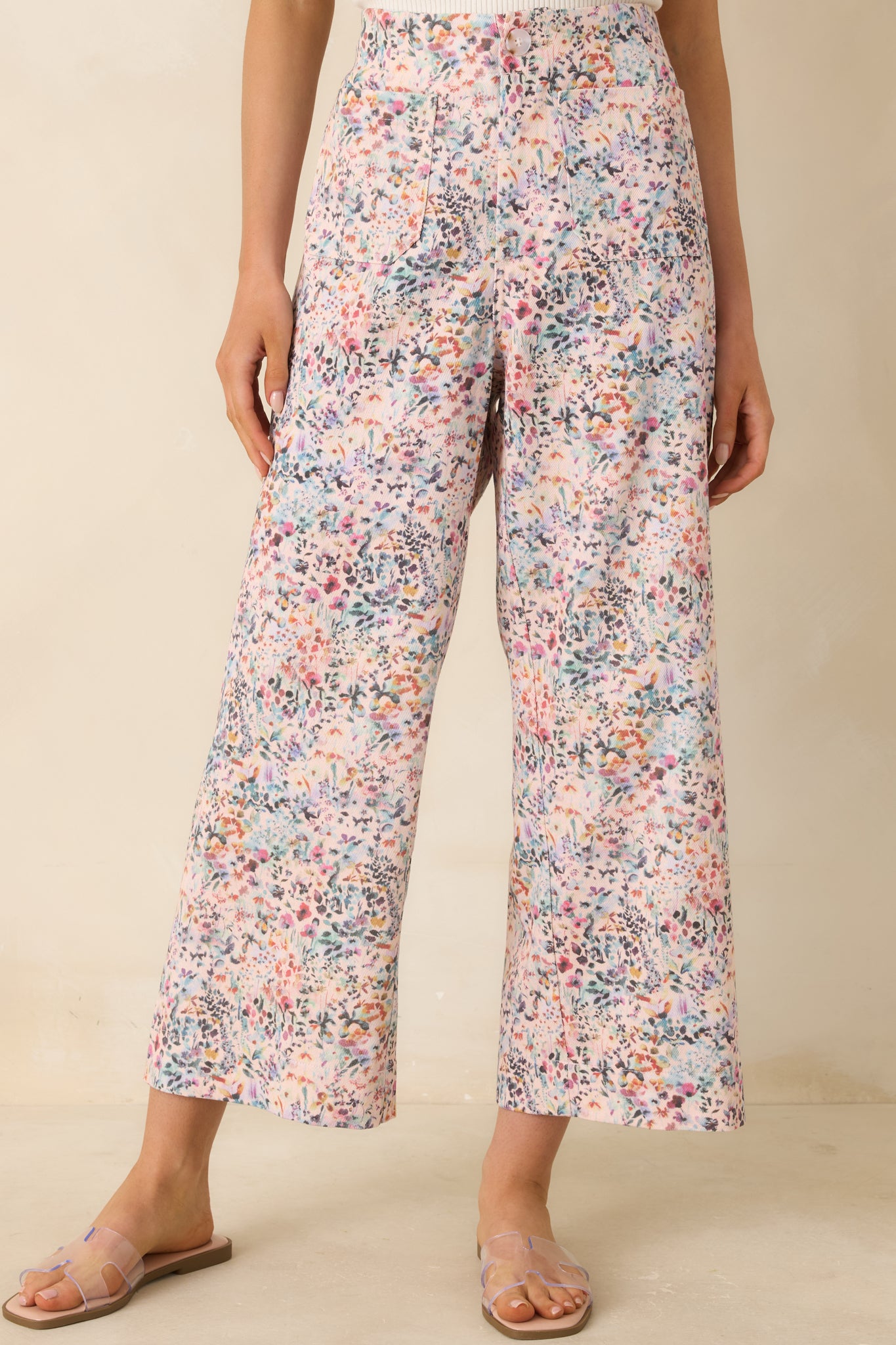 Close view of structured front waistband with button closure detail.
