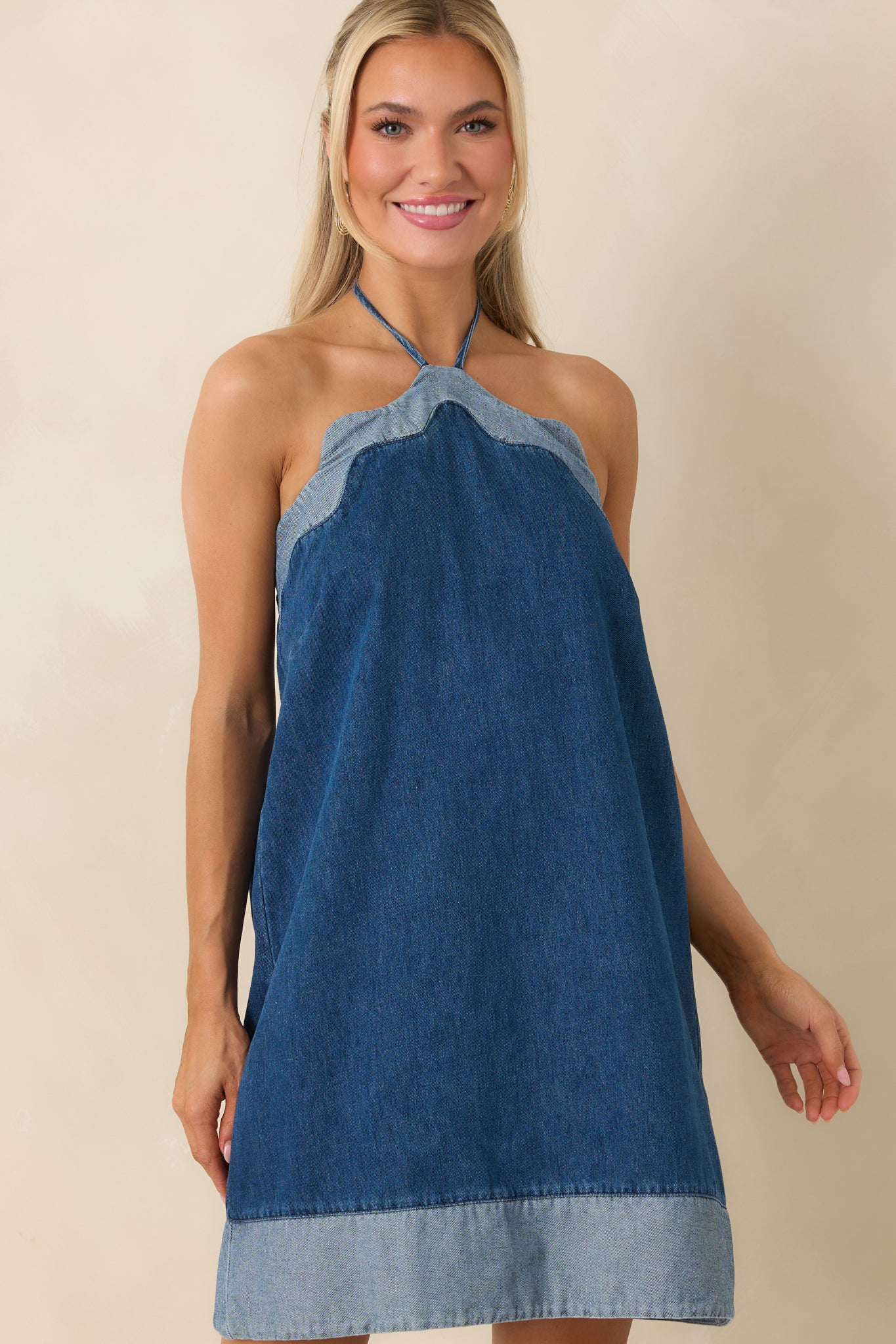 Close view of swing-style silhouette highlighting lightweight denim texture.