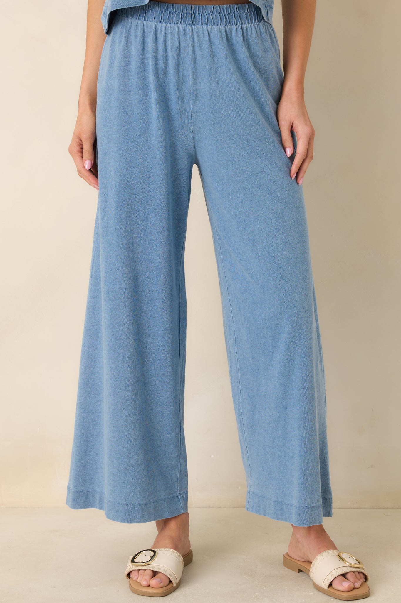 Close-cropped image showing the wide-leg shape and lightweight jersey fabric in washed indigo.