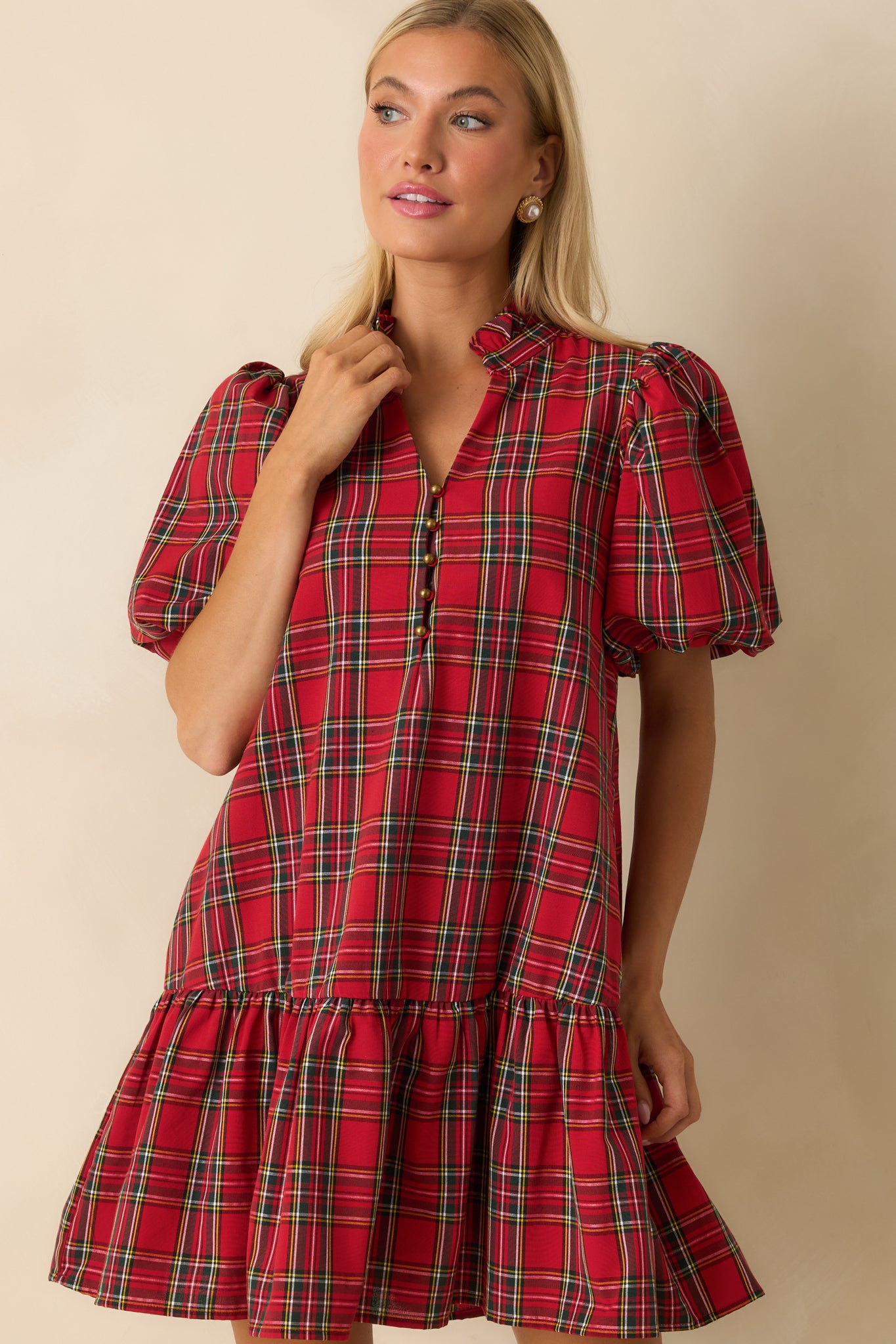 Detail of soft woven fabric and plaid pattern on the mini dress.