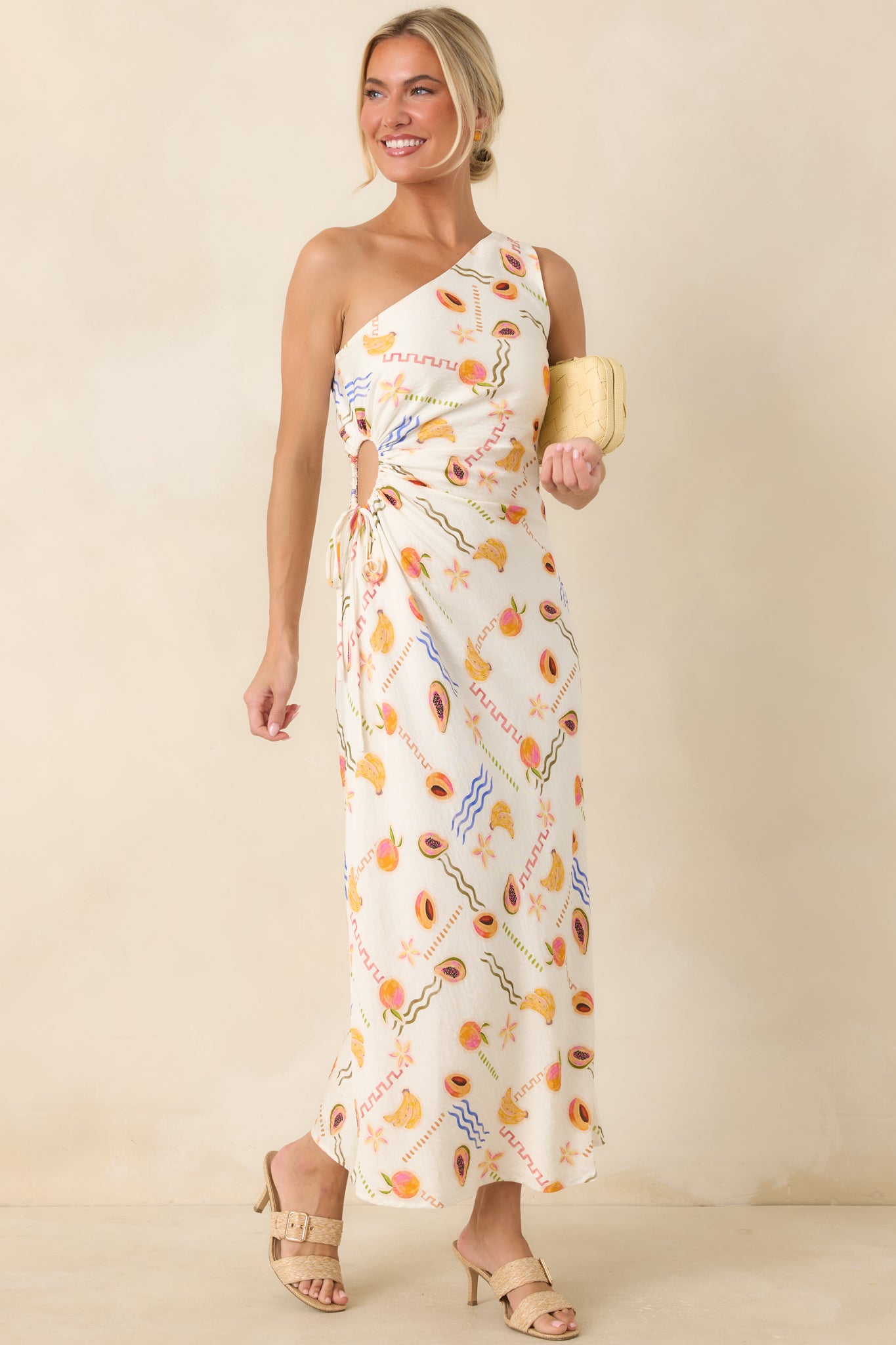 Breezy maxi dress with peaches, bananas, passionfruit, and coastal-inspired graphics on lightweight fabric.