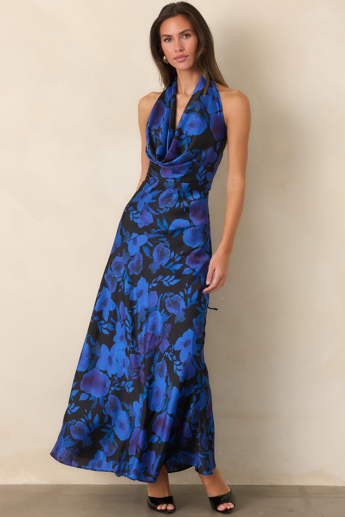 Cobalt and violet floral maxi dress with a halter neckline, defined waist, and softly flowing skirt.
