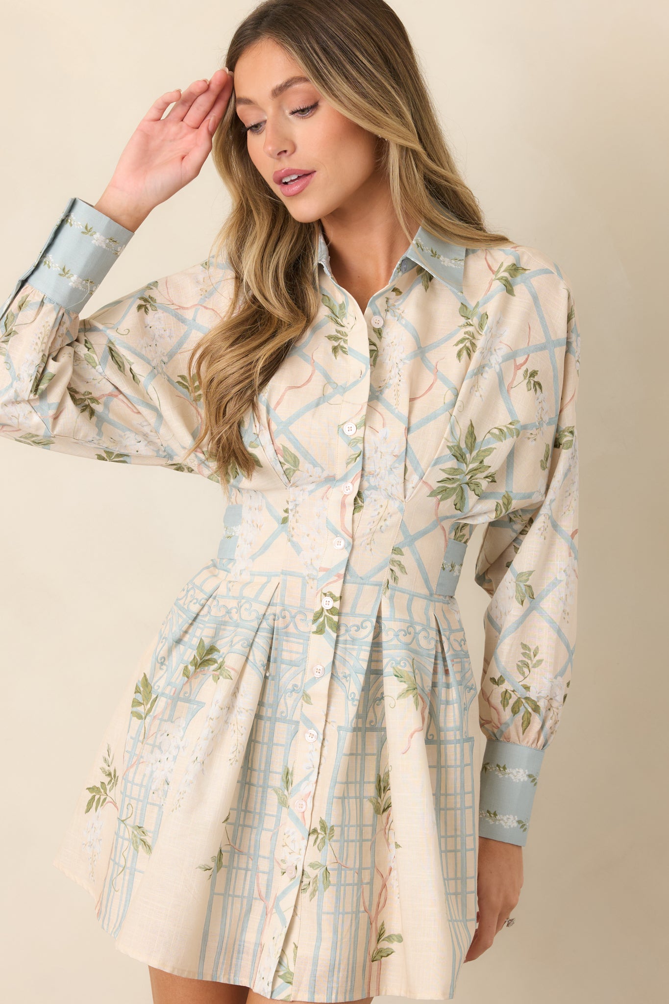 Shirt dress highlighting the classic collar, button-front placket, and defined waist that creates a clean, tailored silhouette.