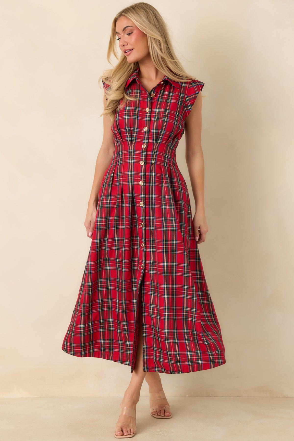 Fitted collared dress with a shaped bodice, full pleated skirt, and functional side pockets.
