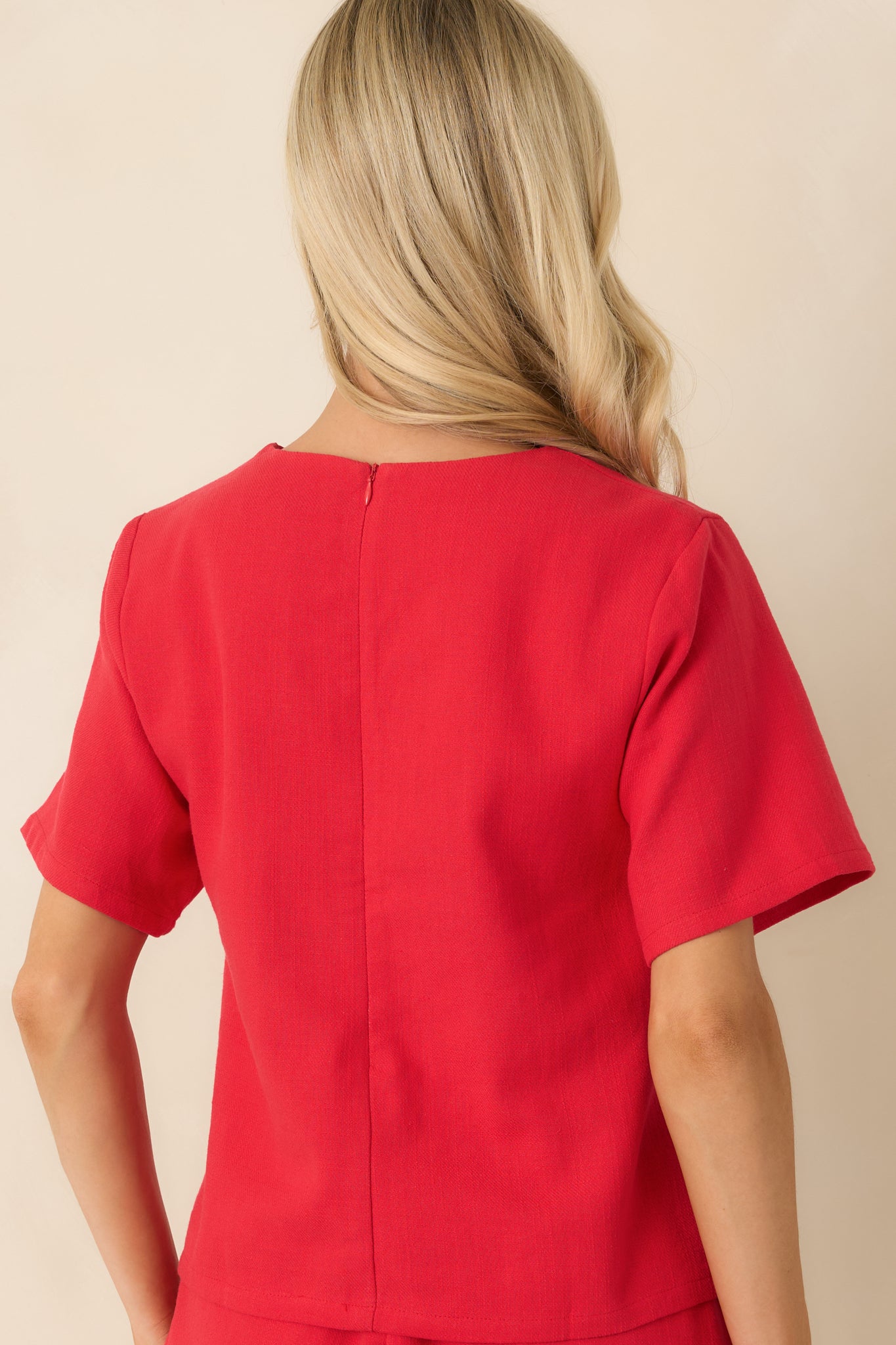 Back view of the colorblock top highlighting the relaxed fit and red panel design.