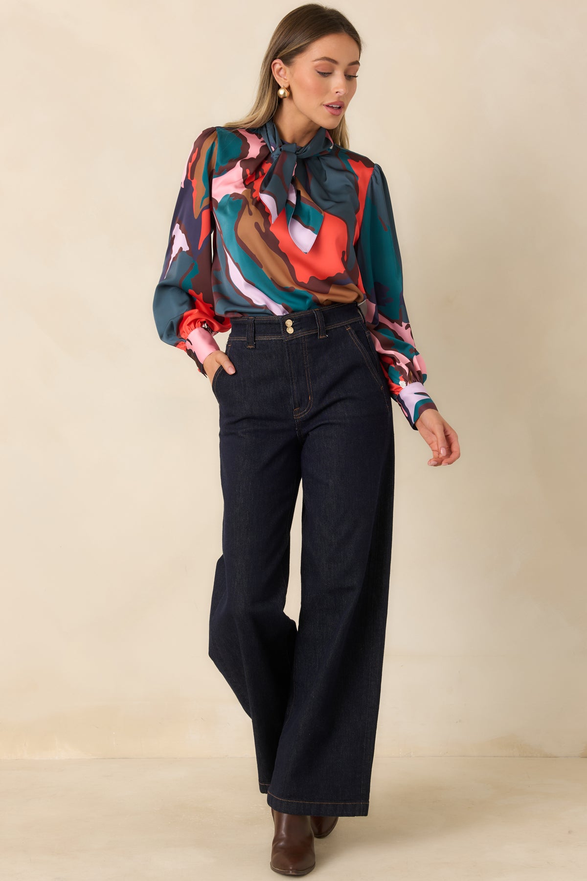 Colorful abstract blouse with a relaxed drape and rounded neckline.