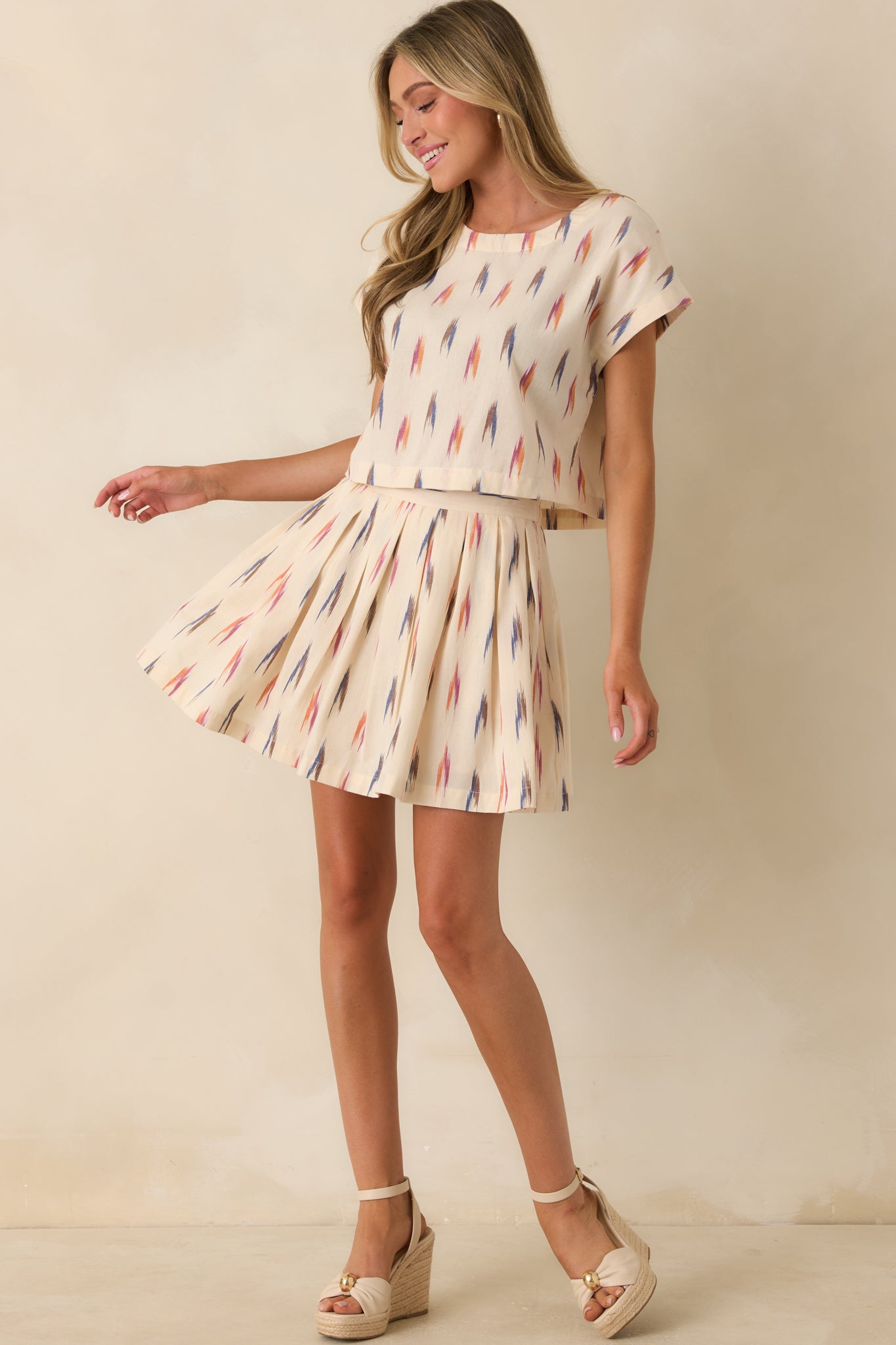 Colorful abstract print on lightweight ivory cotton with artistic brushstroke-inspired details.
