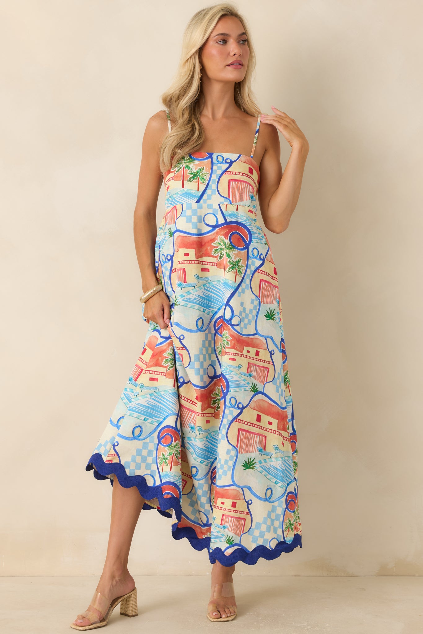 Long maxi dress with a colorful coastal print, smocked back panel, and relaxed fit designed for warm-weather styling.
