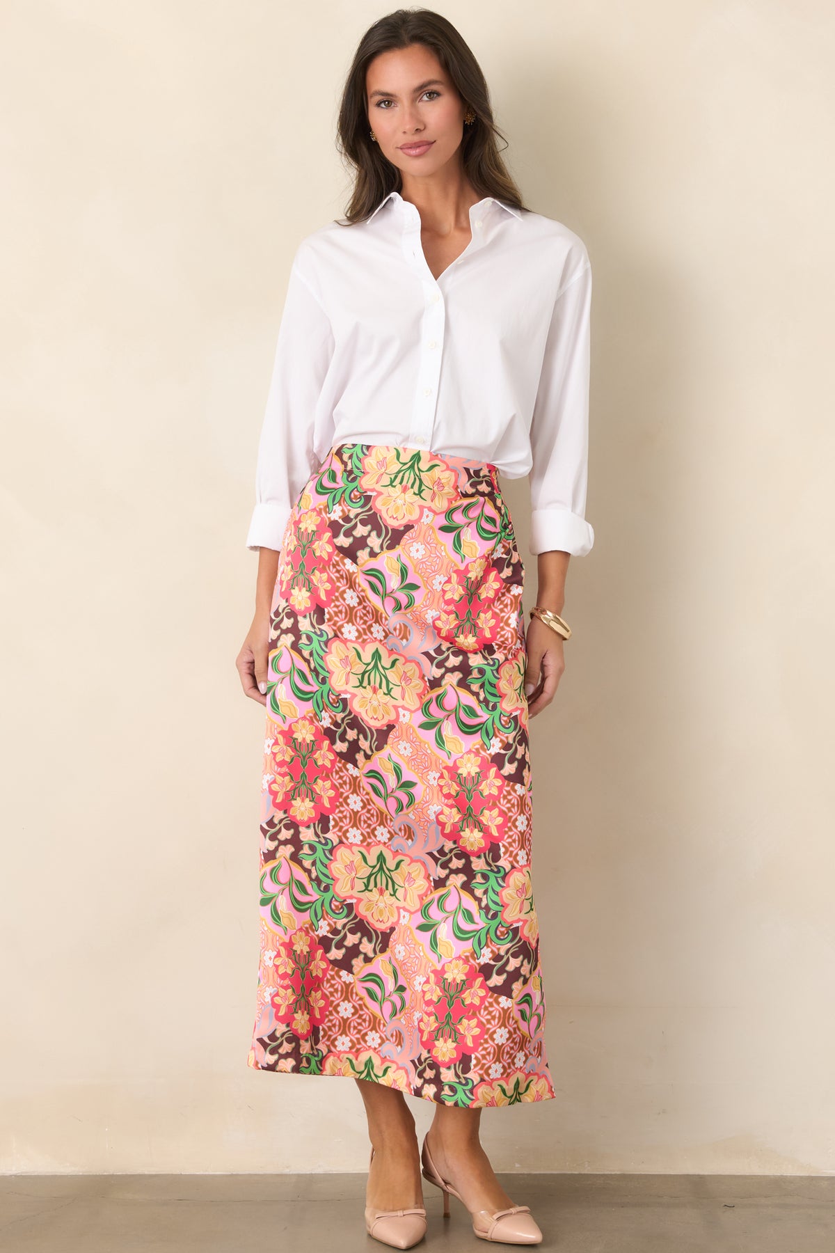Colorful floral midi skirt with a smooth front waistband, lined interior, and functional side pockets.