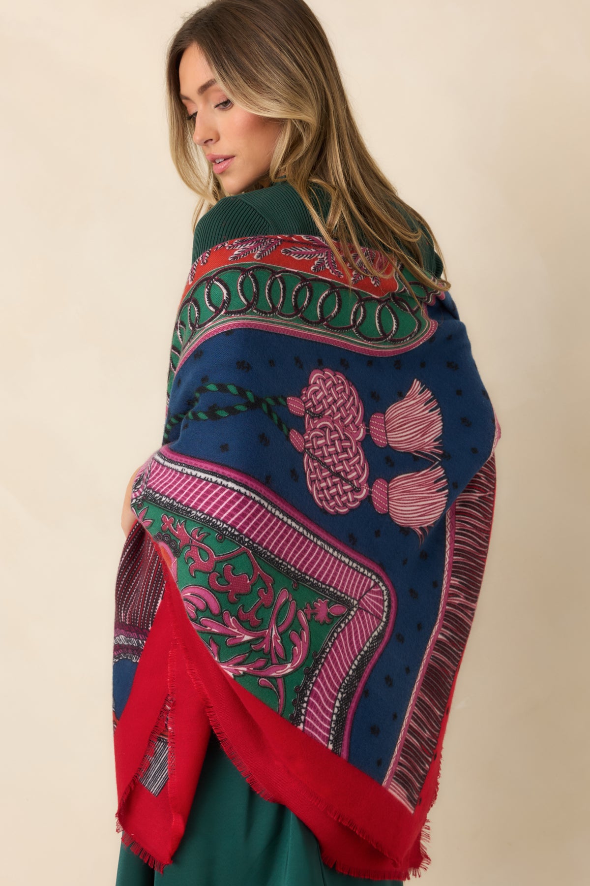 Colorful printed item featuring decorative rope knots, tassels, and interlocking rings in red, navy, green, and pink.
