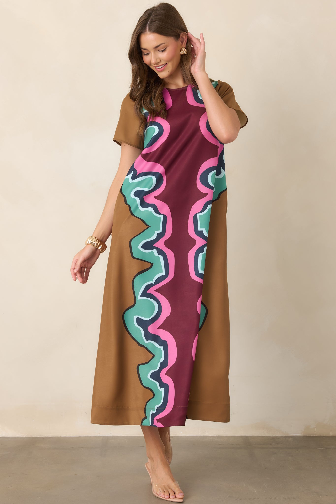 Colorful serpentine-print maxi dress highlighting its easygoing silhouette, flowing length, short sleeves, and vibrant mix of warm and cool tones.