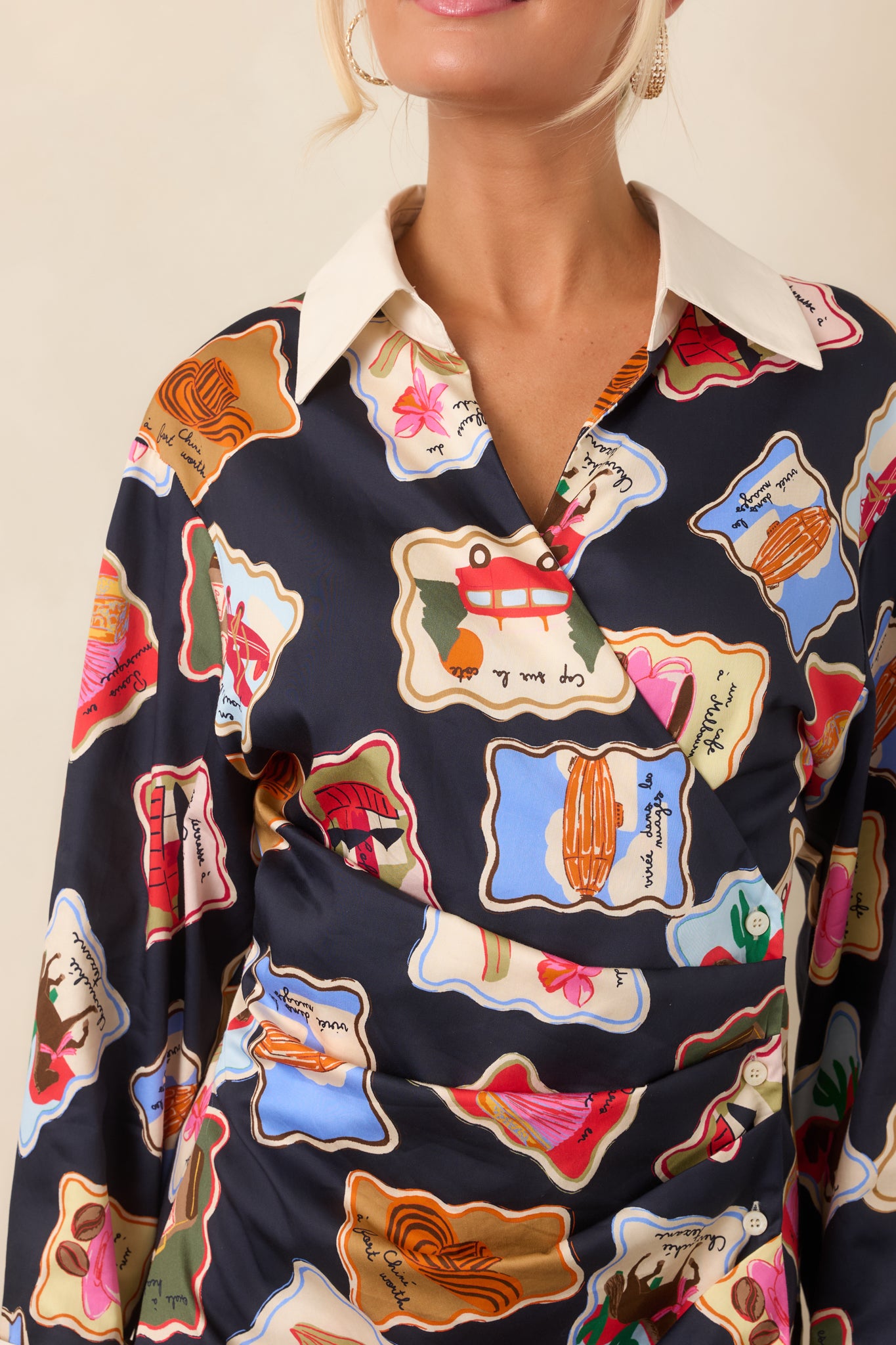 Close-up of the colorful stamp-inspired print alongside the ivory trim, highlighting the playful illustrated details and contrasting finishes.