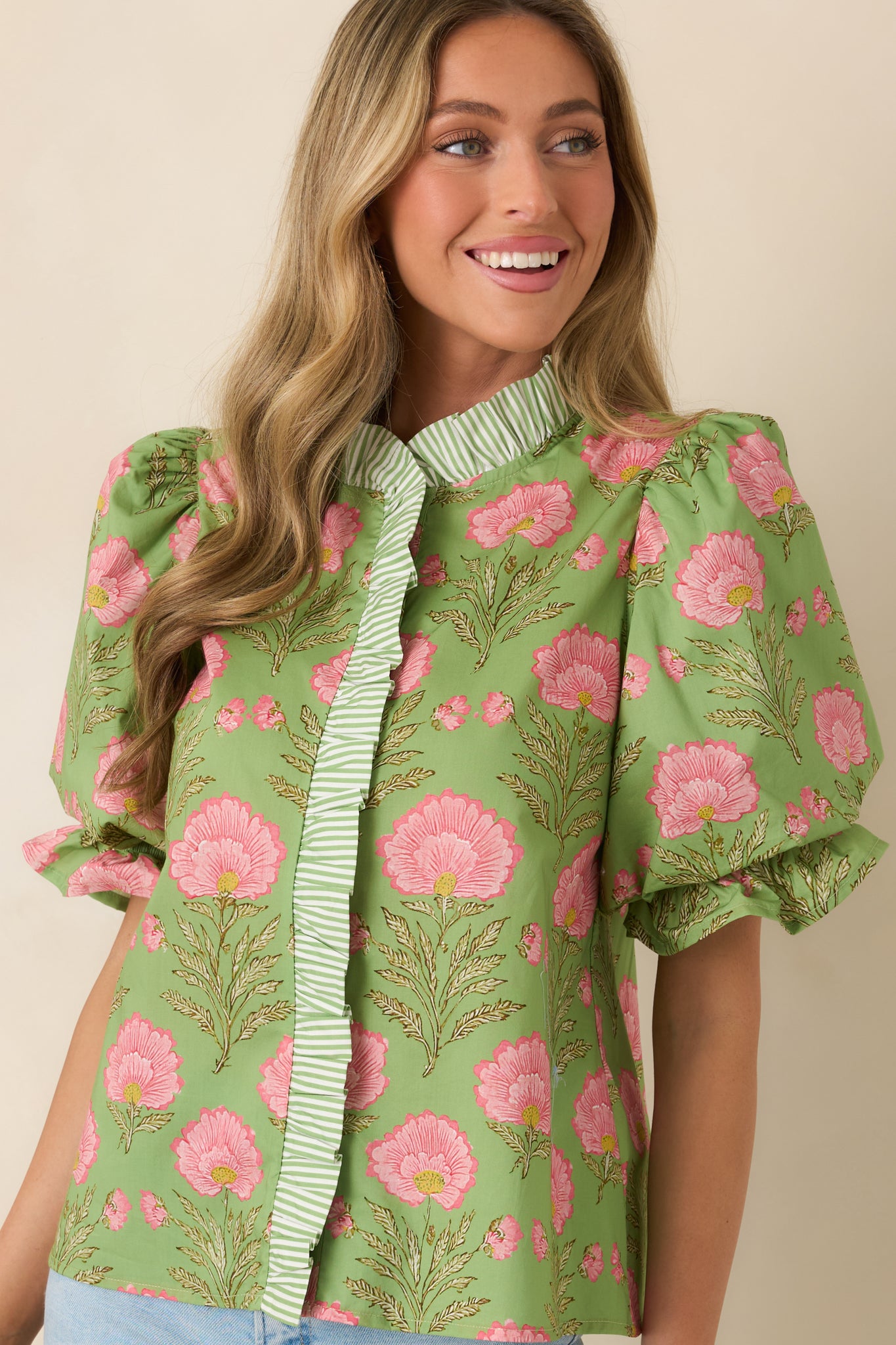 Contrast stripe detailing along front placket for visual interest.