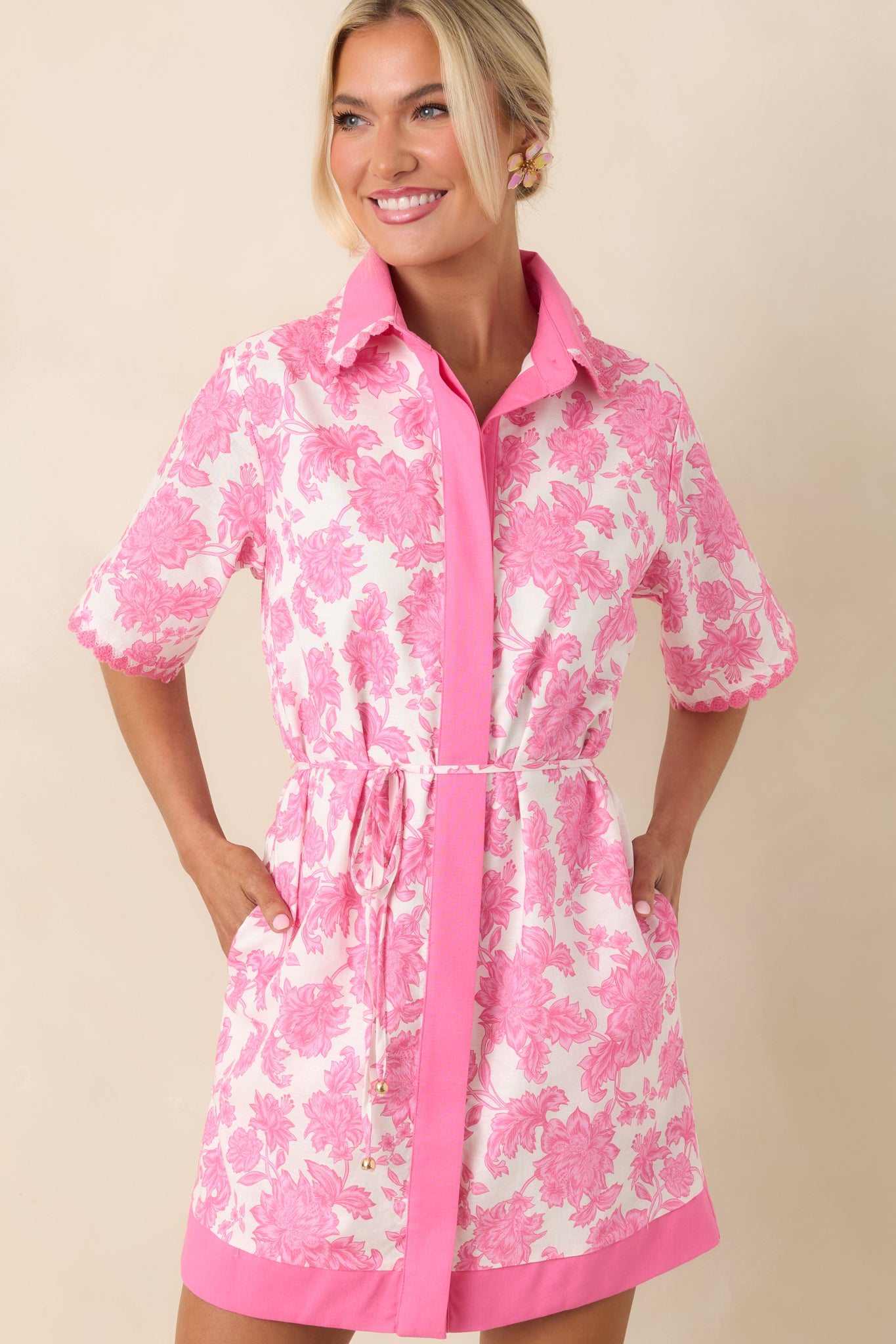 Contrast trim framing floral print with clean, tailored stitching detail.
