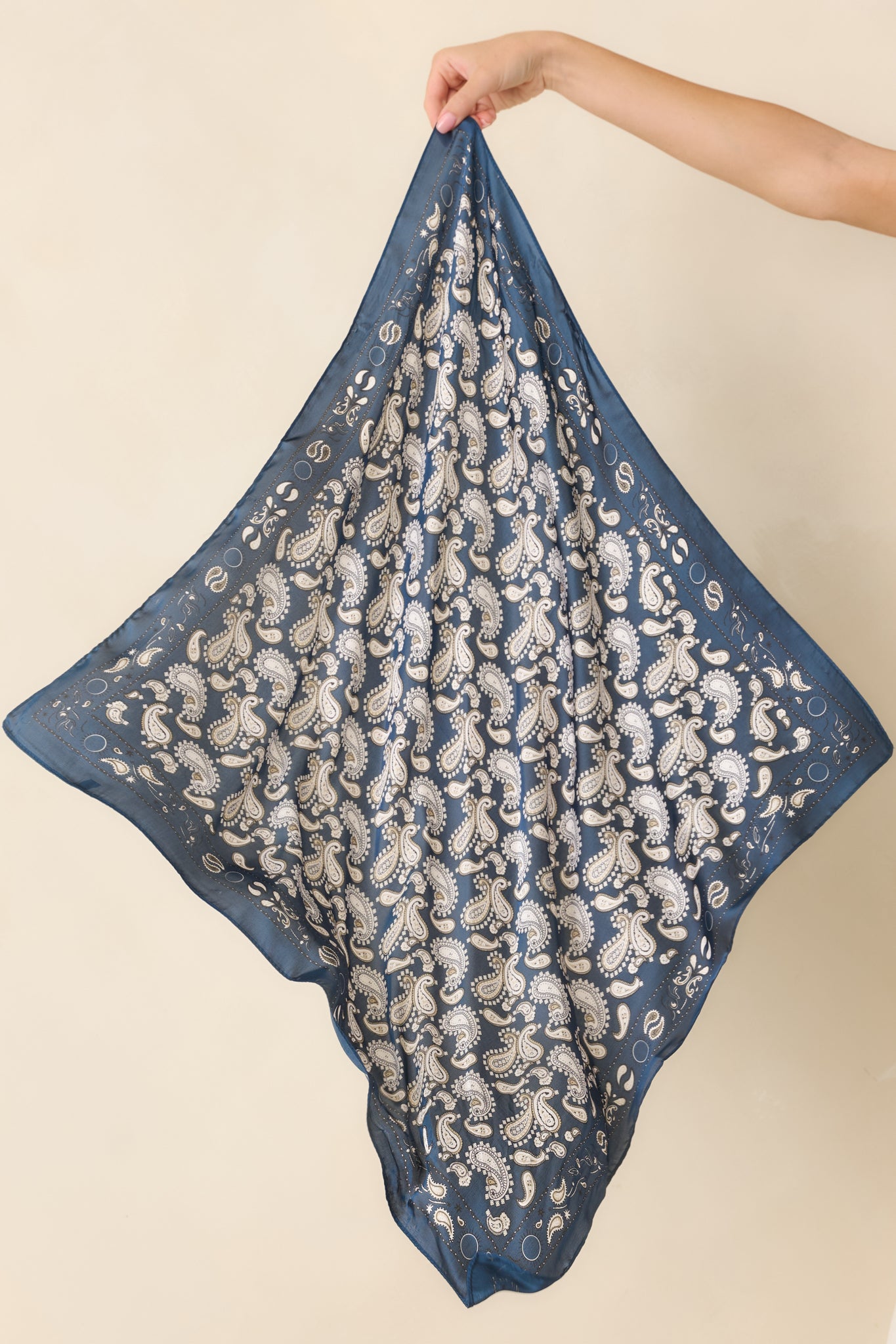 Closer look at the hair scarf emphasizing the coordinating border and refined navy and ivory paisley design.