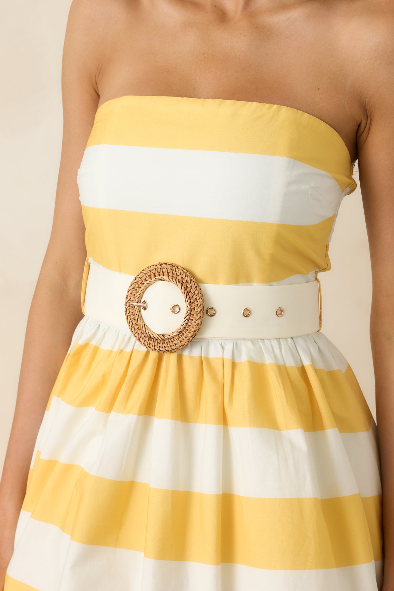 Coordinating waist belt with striped fabric and structured bodice detail.